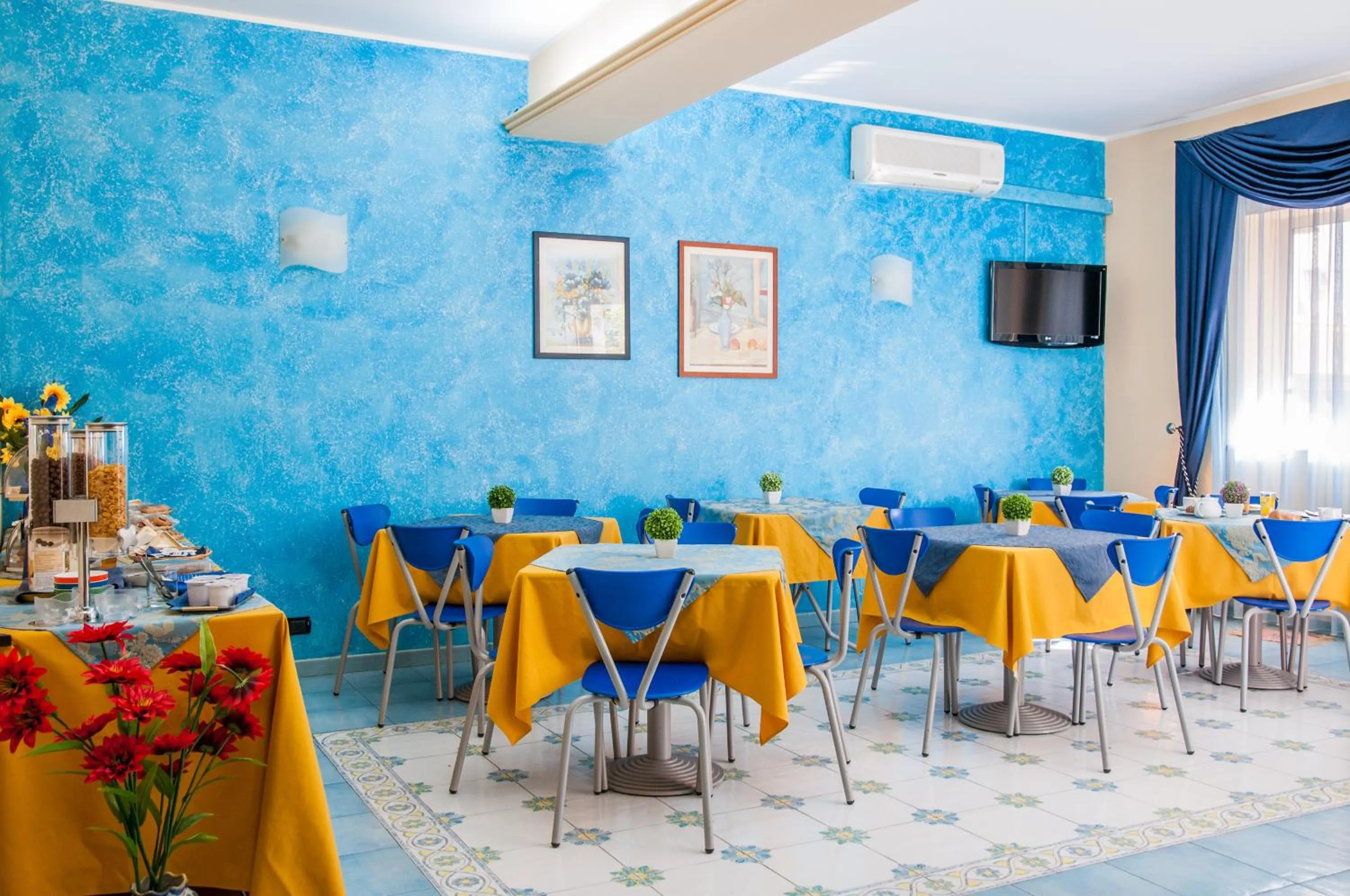 Communal lounge/ TV room in Megaron Hotel