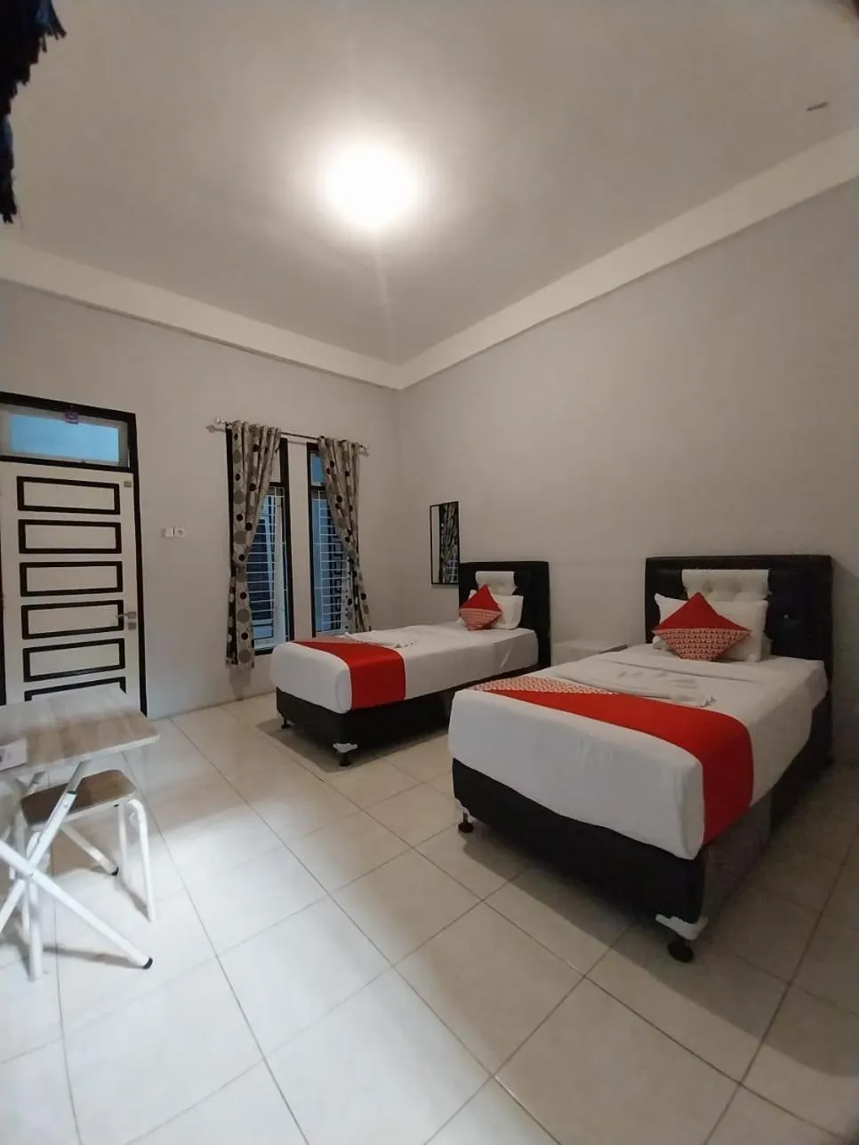 Bed in Dnaiko Syariah Hotel