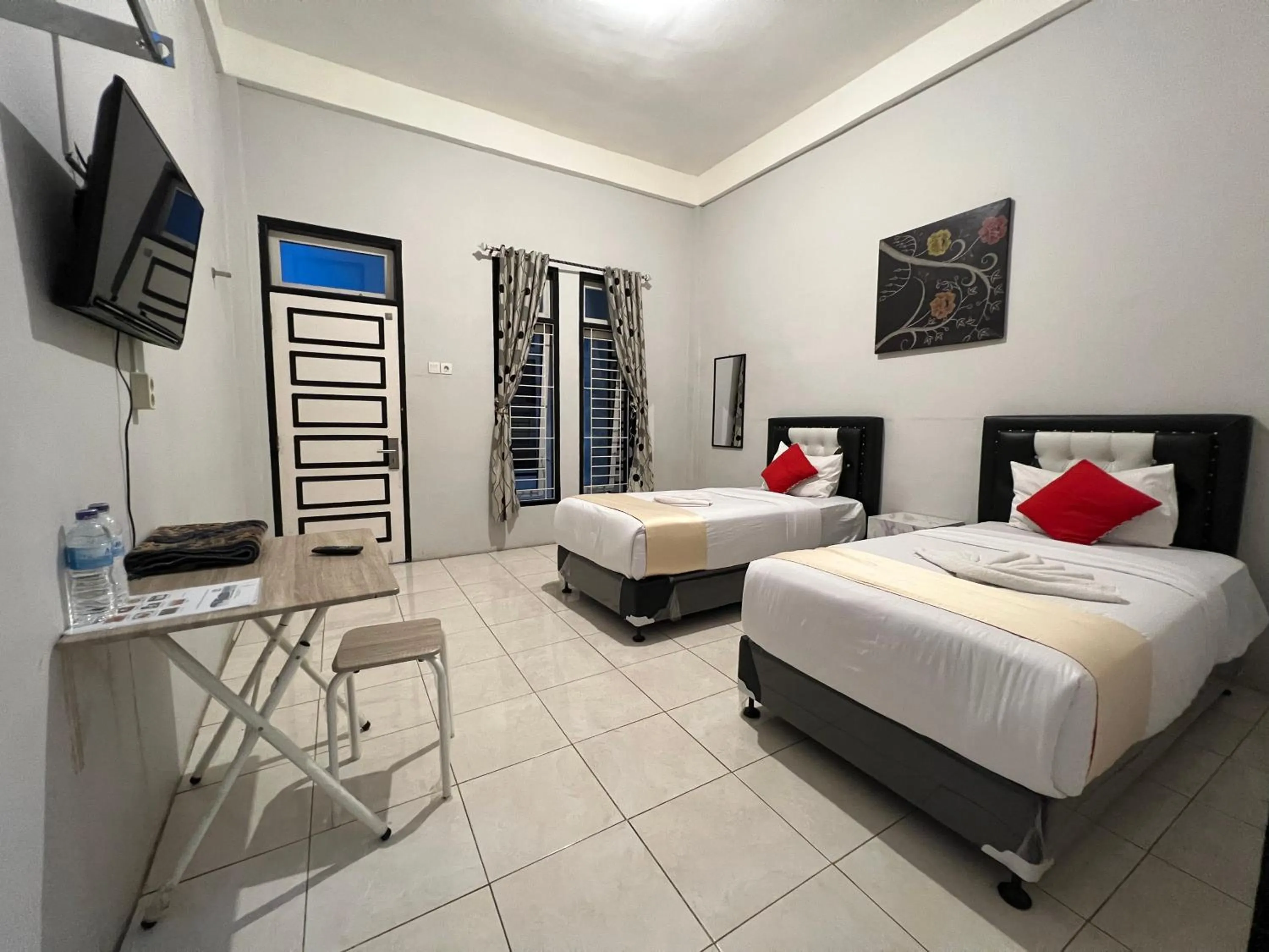 Bed in Dnaiko Syariah Hotel