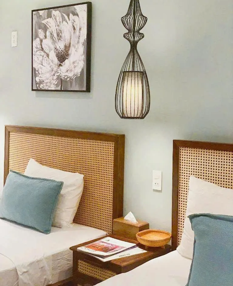 Bed in FLOWER BEACHSTAY & COFFEE