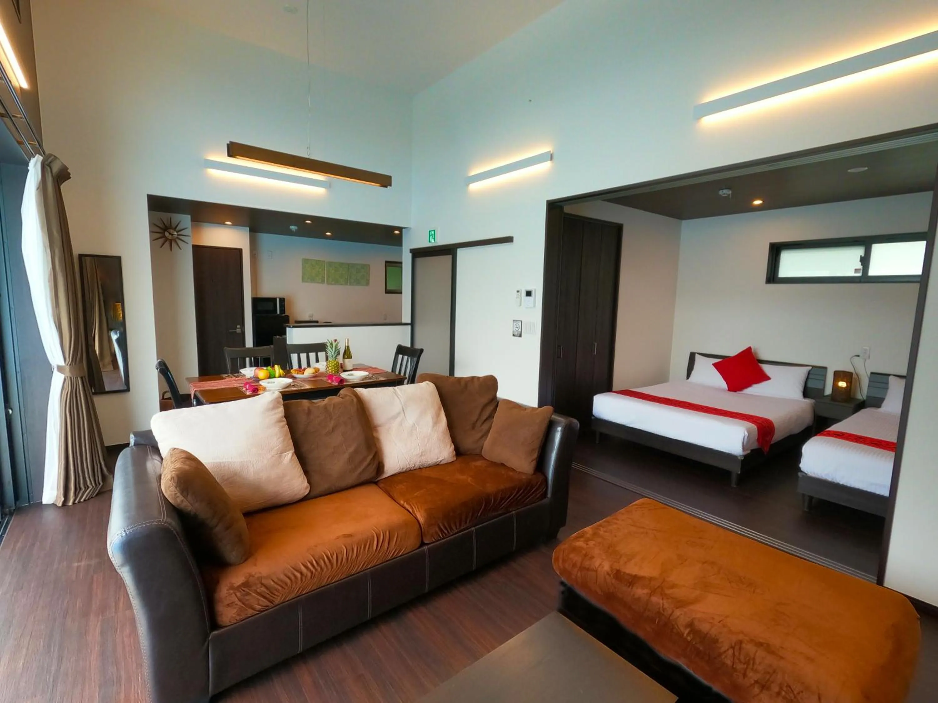 Living room, Bed in Private Pool Villa Motobu