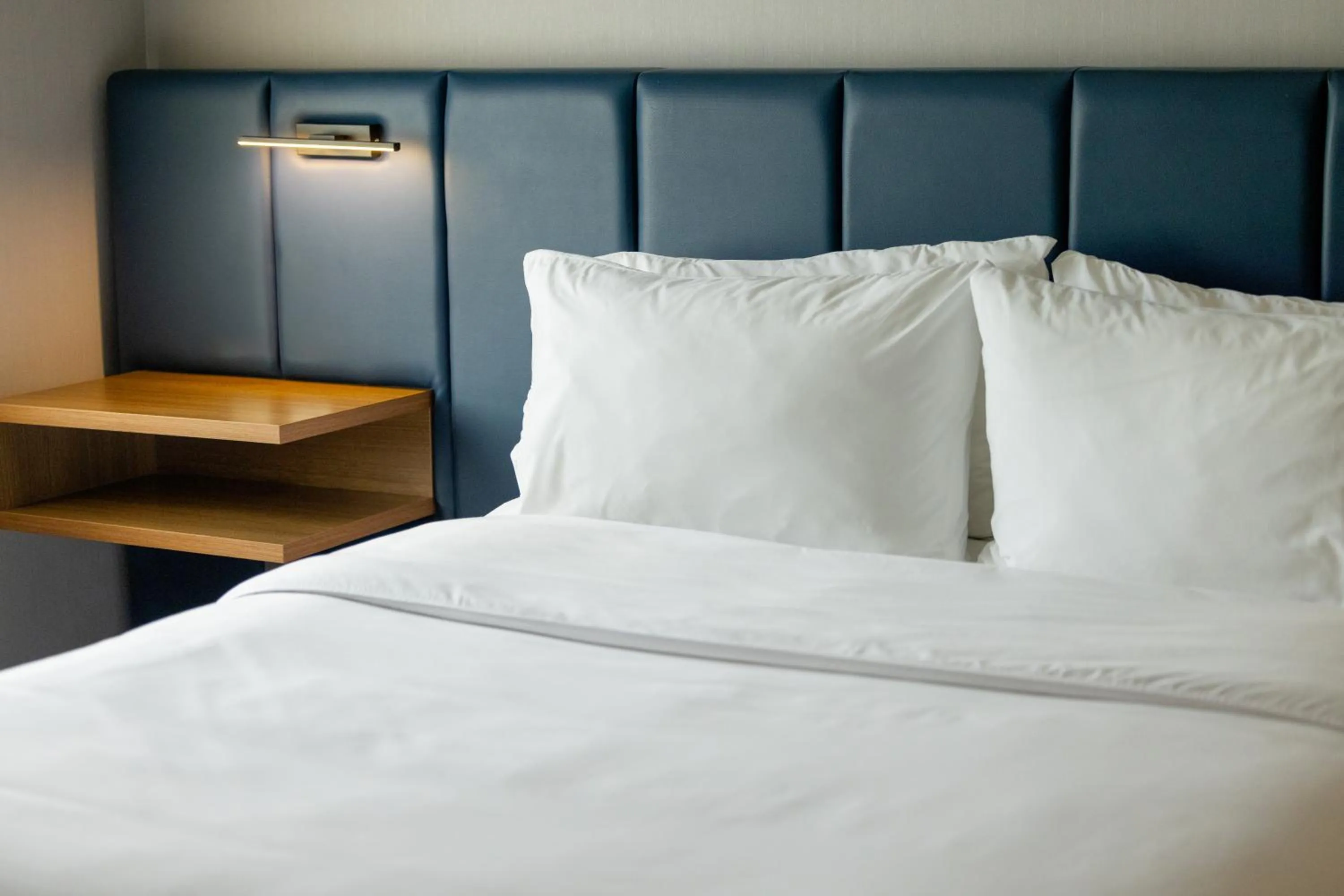 Bed in voco Saltillo Suites by IHG