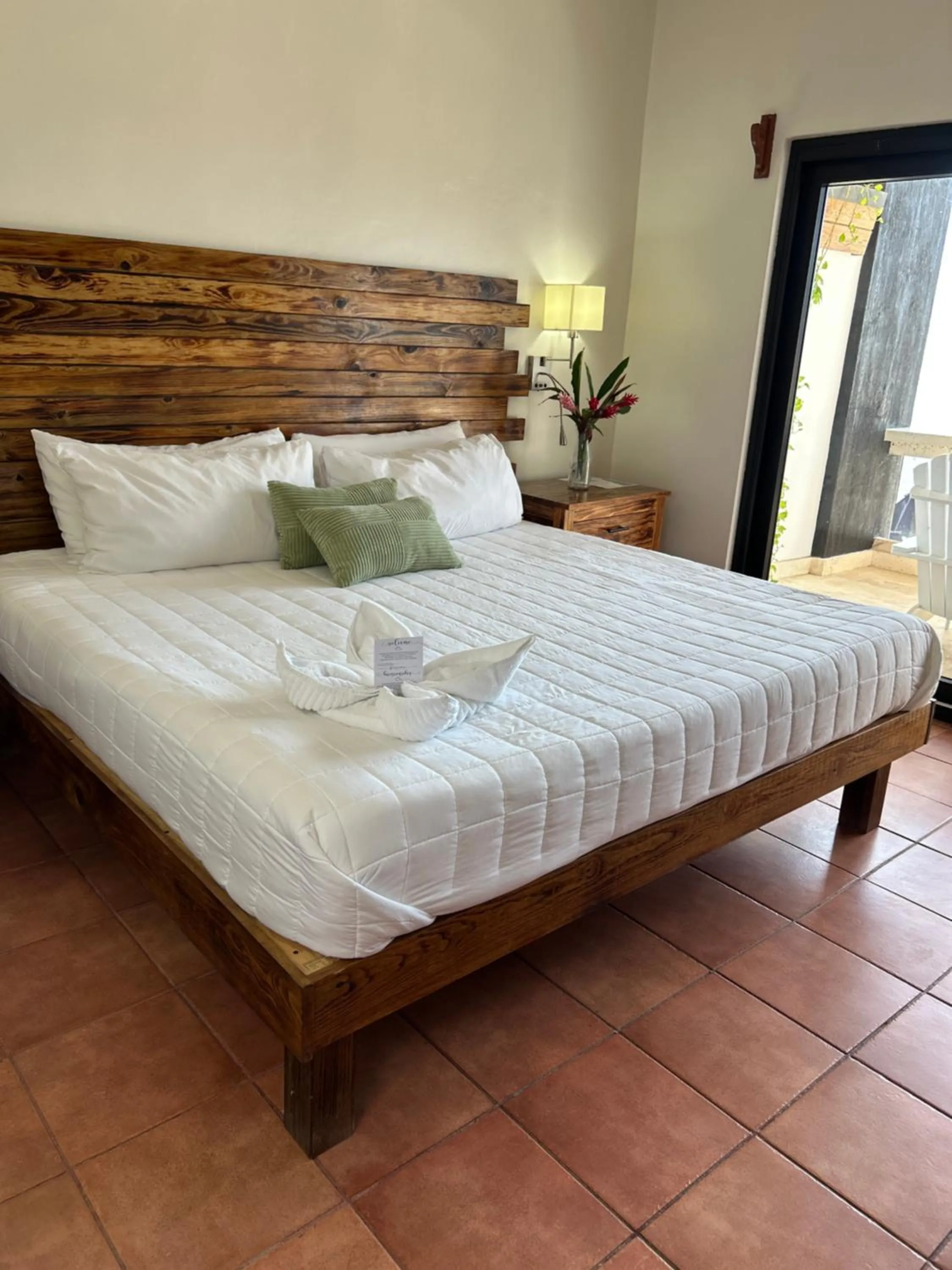 Bed in Brisas Del Mar Beach + Dive Resort