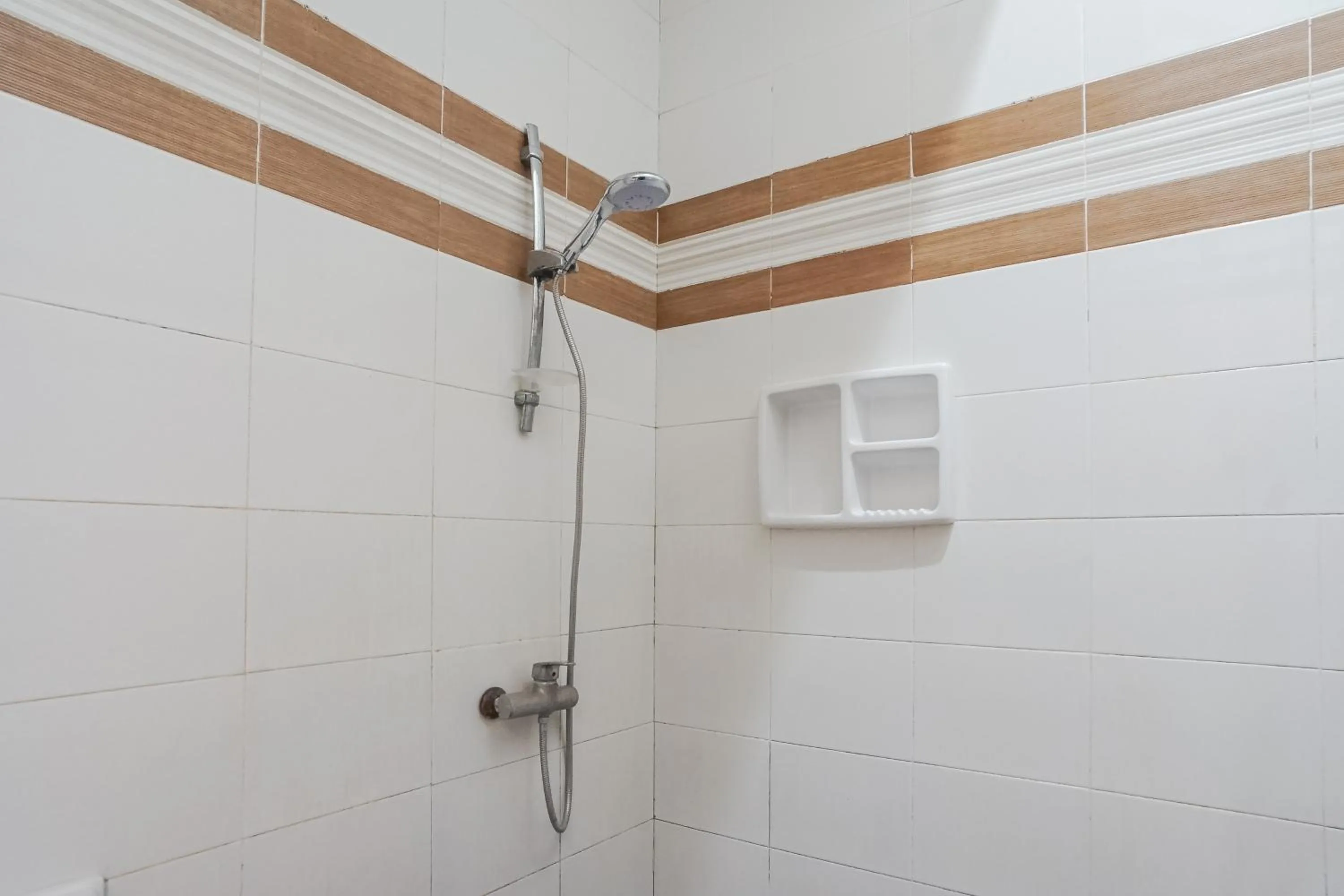 Shower in DENAYS GUESTHOUSE JIMBARAN