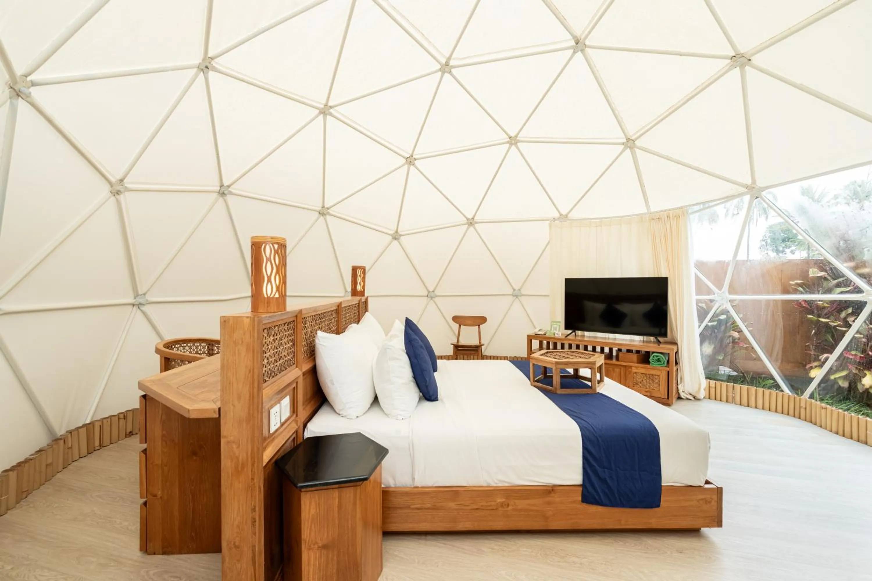 Bed in Triyana Resort and Glamping