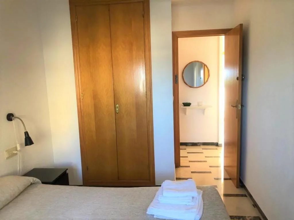 Bedroom, Bed in Acogedor apartamento frente al mar con piscina