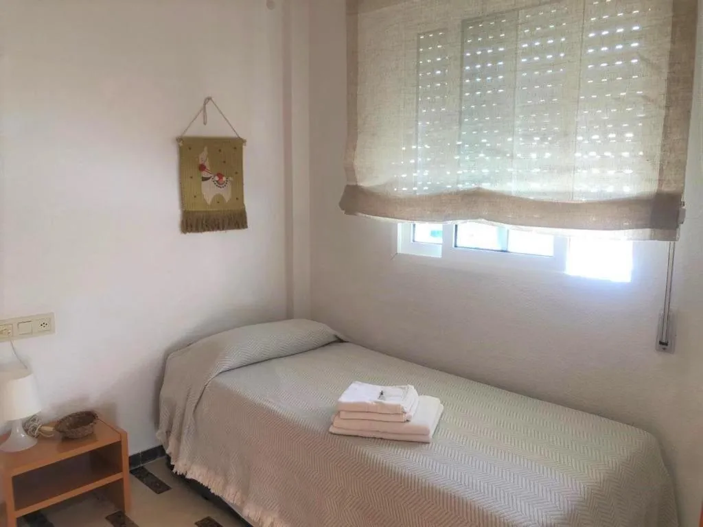 Bed in Acogedor apartamento frente al mar con piscina