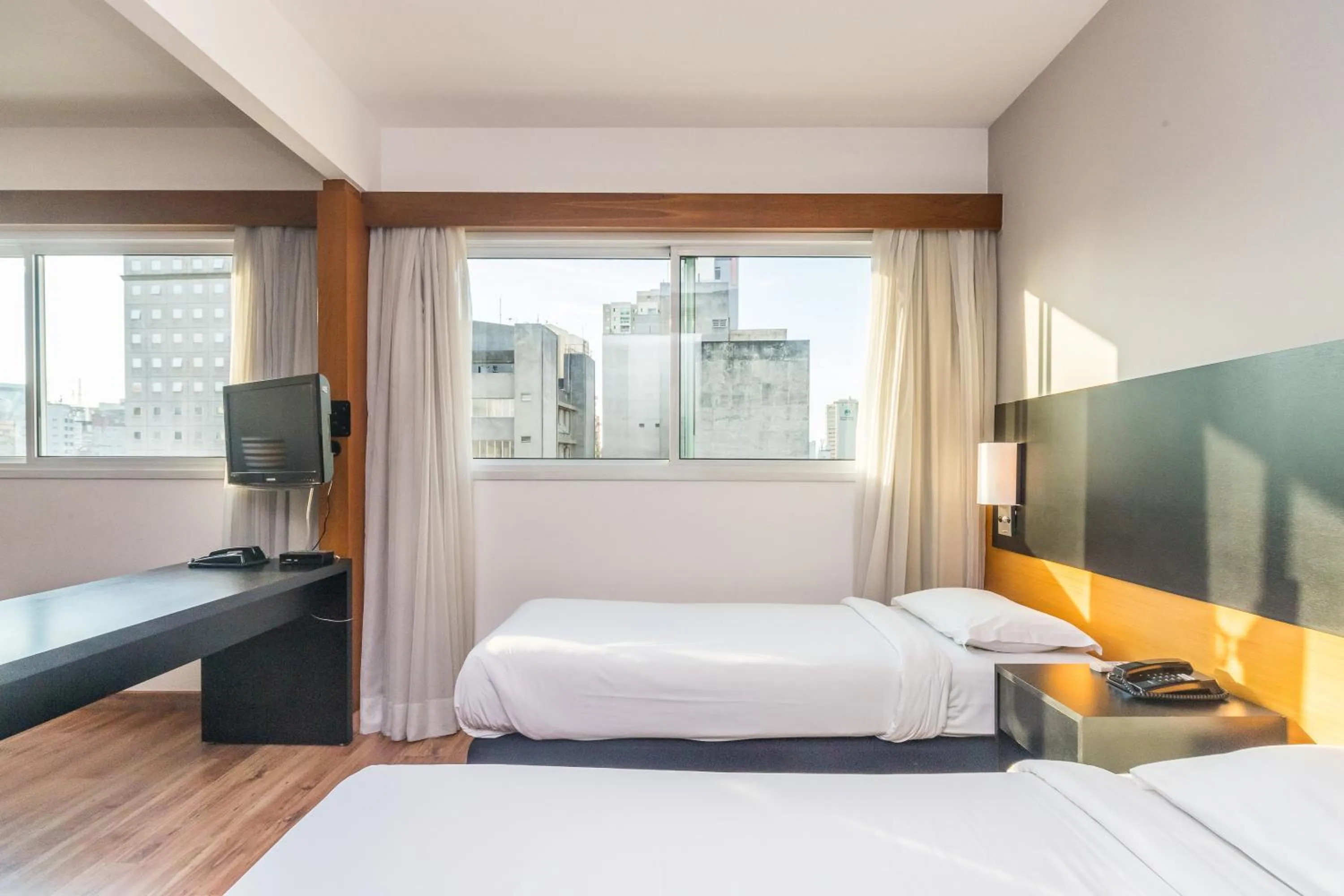 Bed in Paraíso Suítes by Charlie