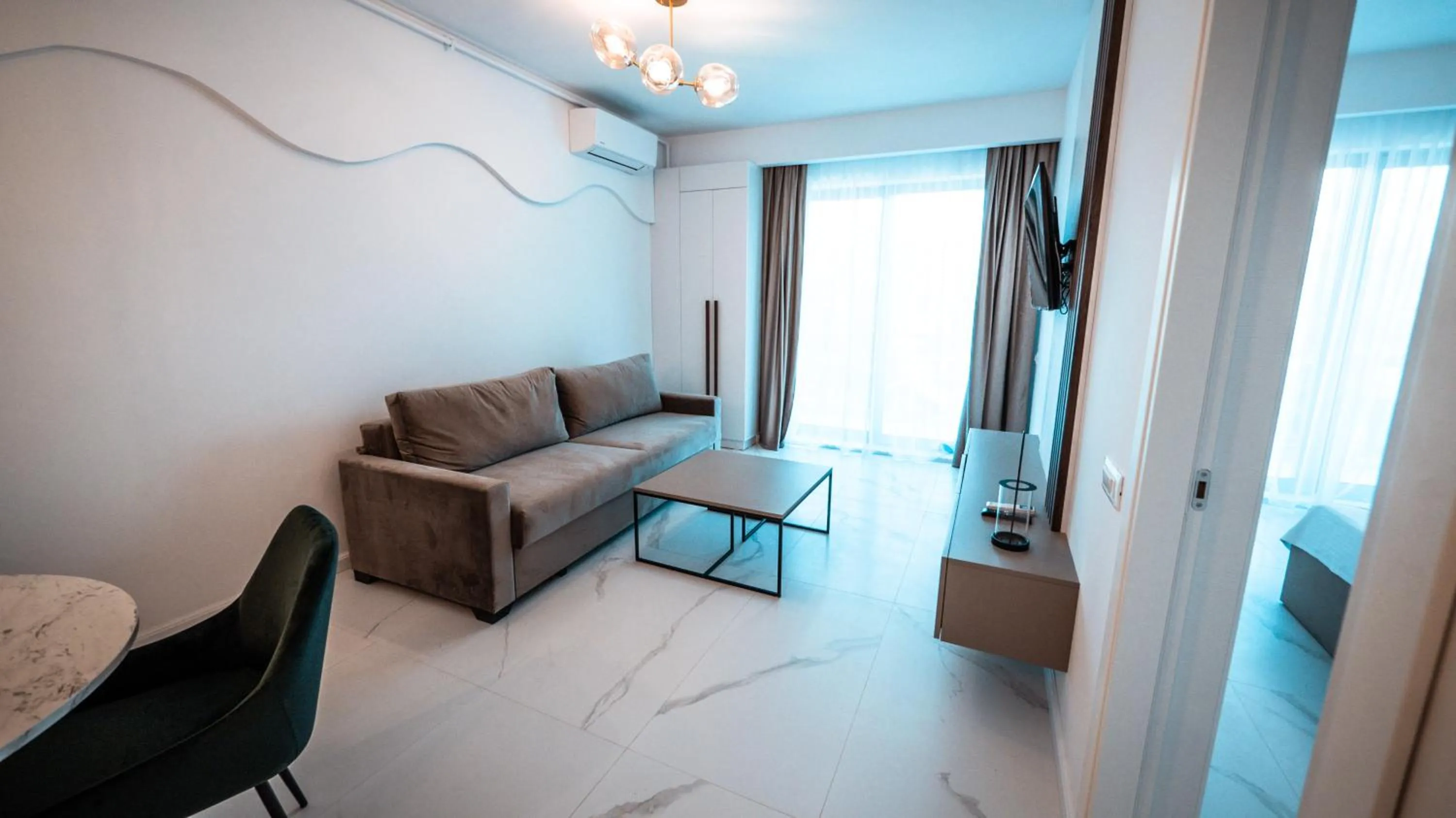 Living room, Bed in WAVE 4 Apartments Mamaia Nord