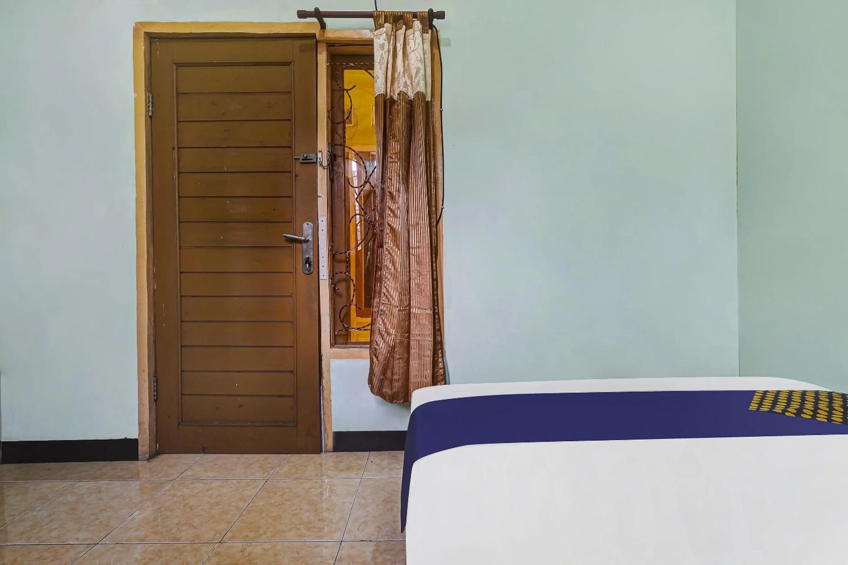 Bedroom in SPOT ON 91159 Kost Putrana Syariah