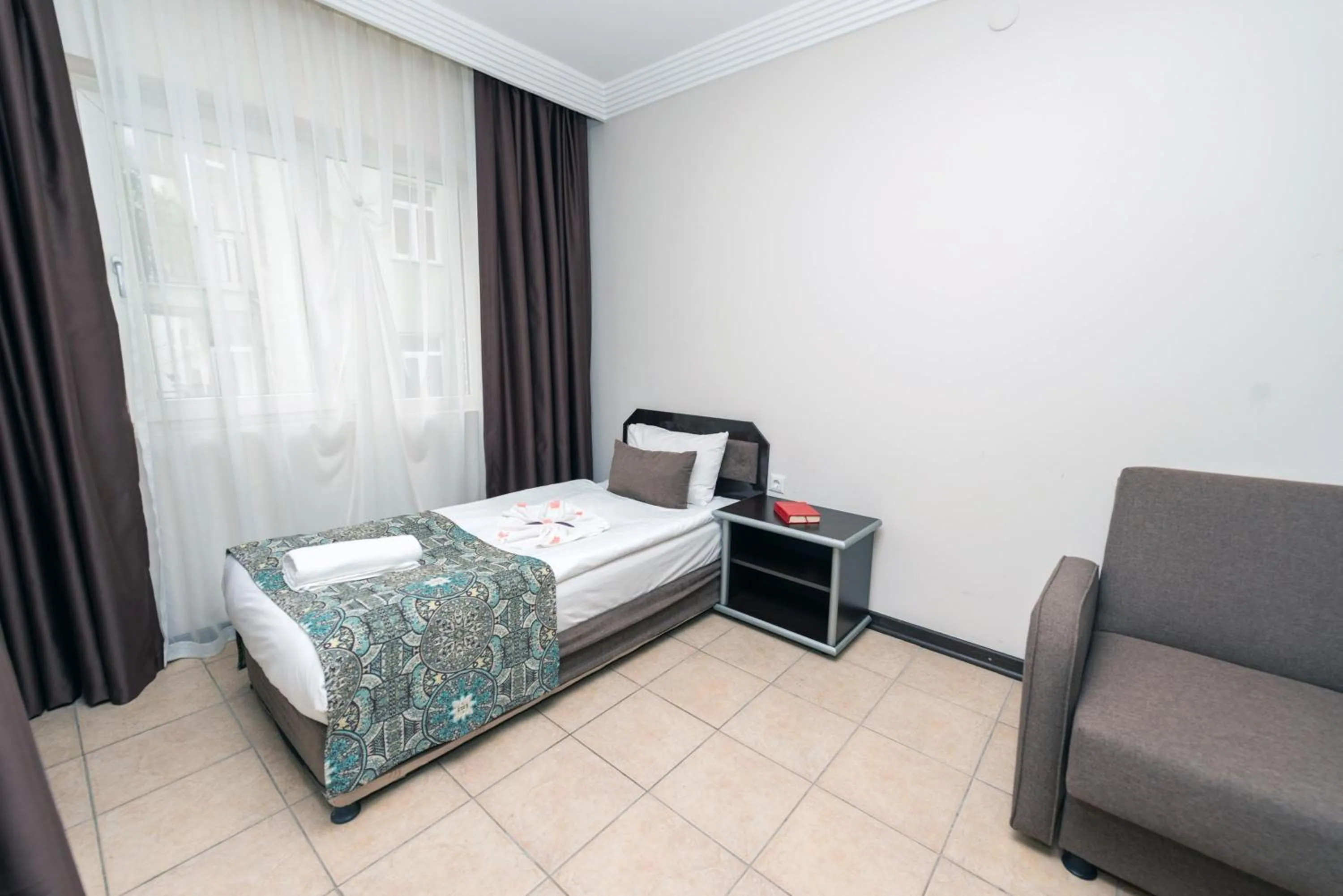 Bed in City Inn Family Apart