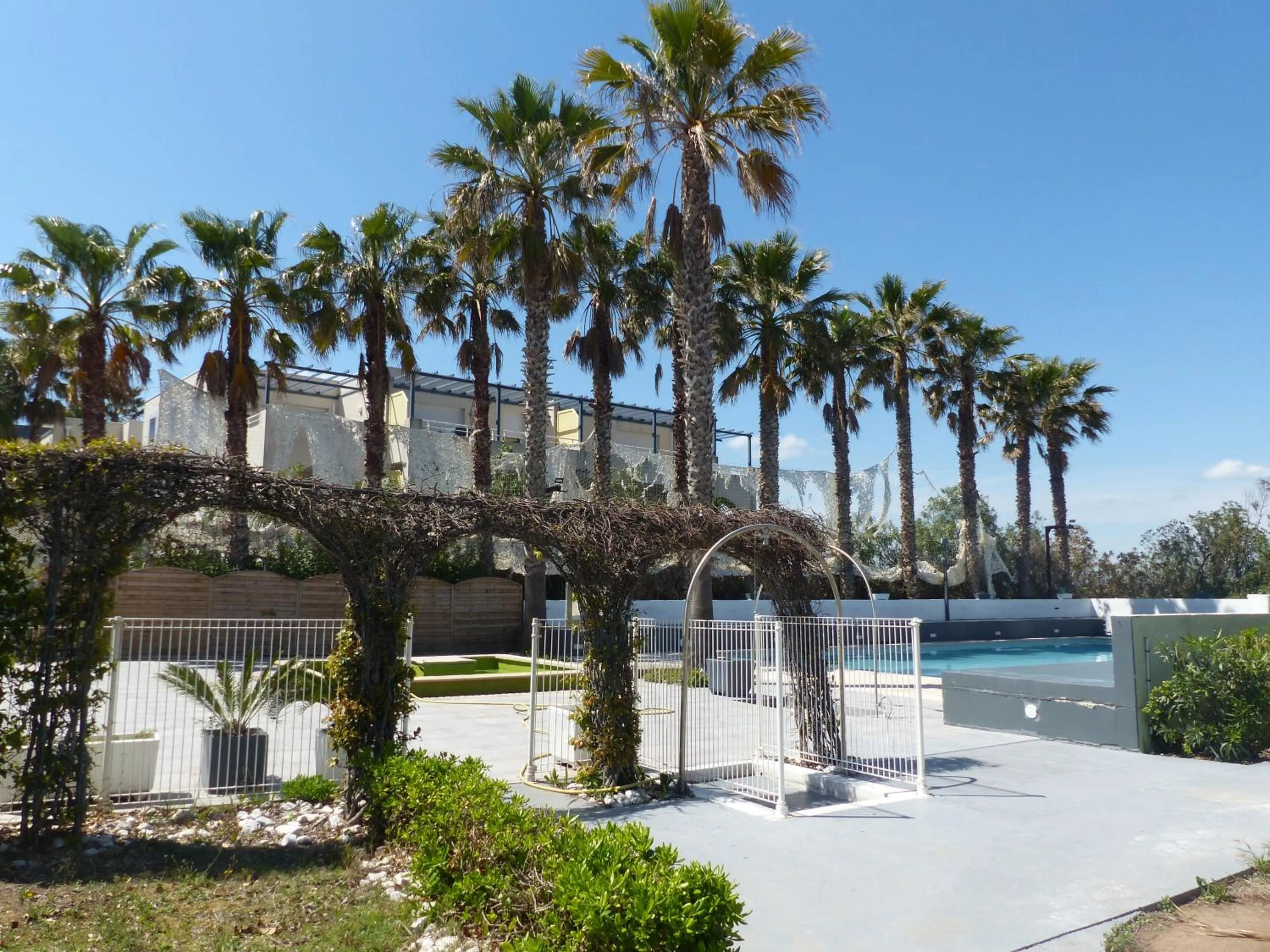 Swimming pool in Le Jardin de Babylone Résidence Festive & Naturiste "réservé aux couples uniquement"