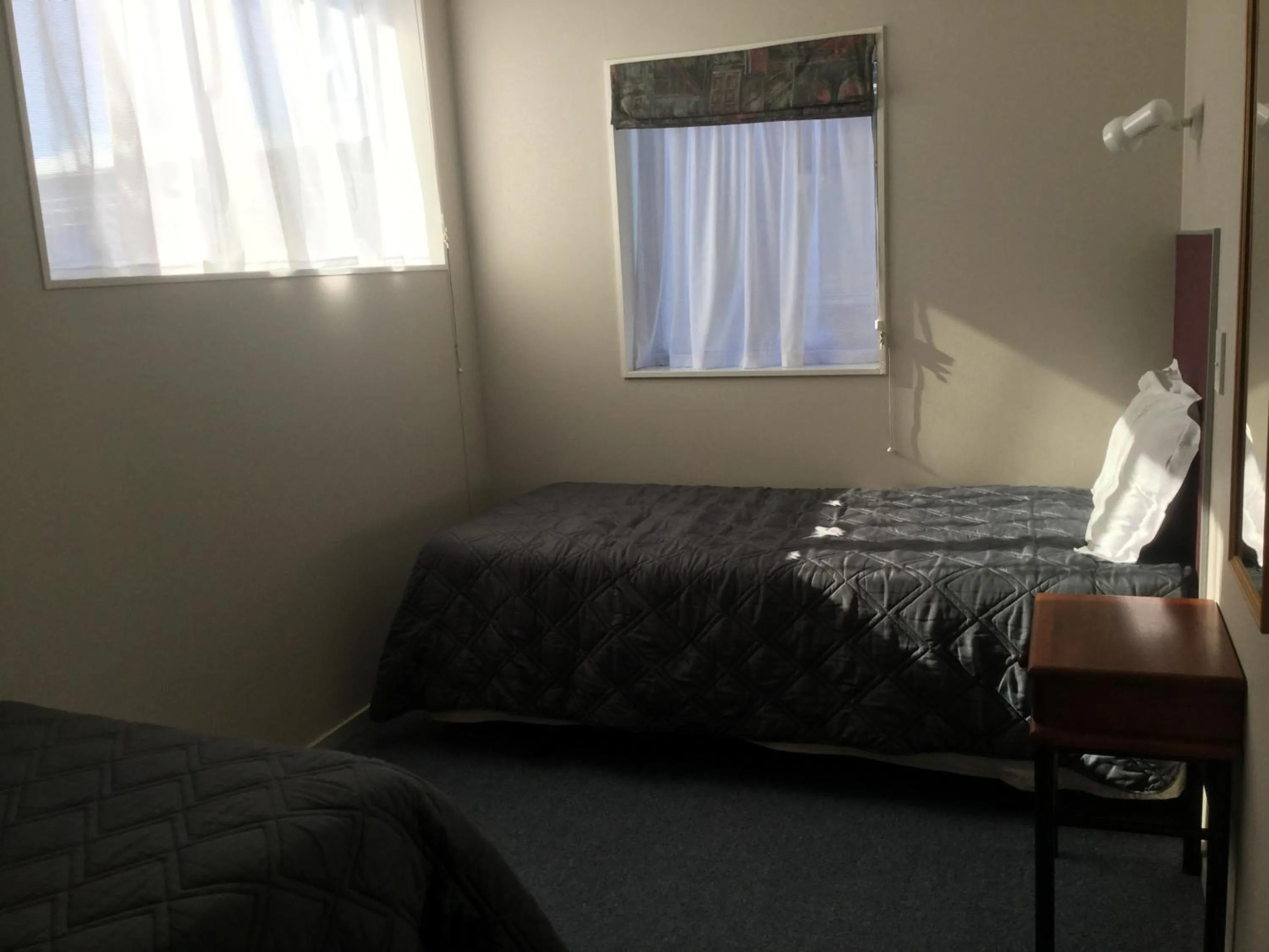 Bed in Thornton Lodge Motel