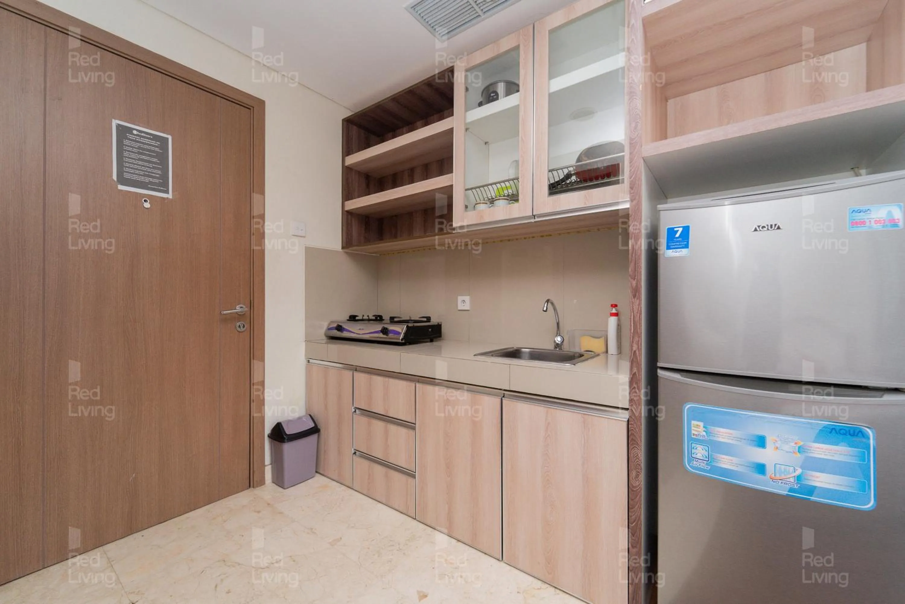 Kitchen or kitchenette in RedLiving Apartemen Puri Orchard - Tower Magnolia