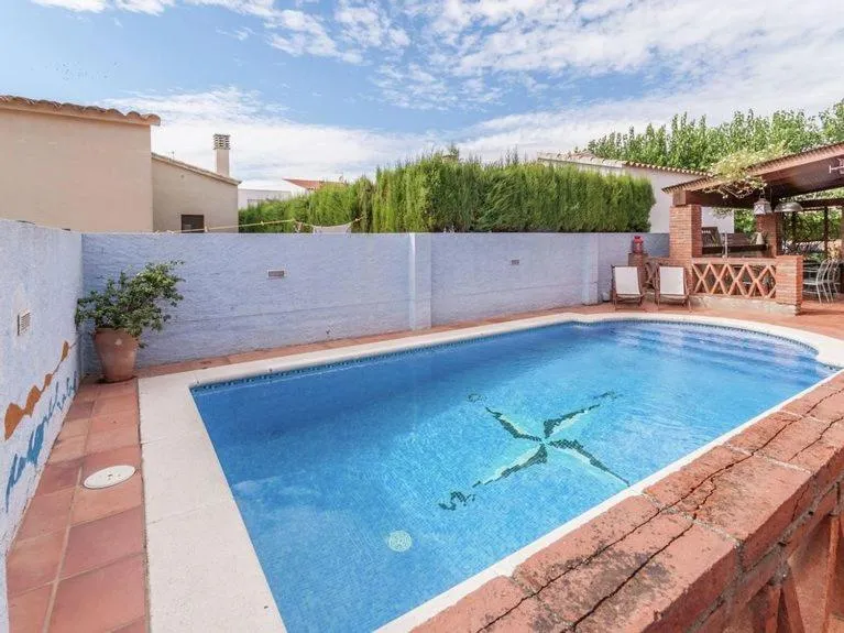 Swimming pool in Cozy holiday home with pool in St Pere Pescador