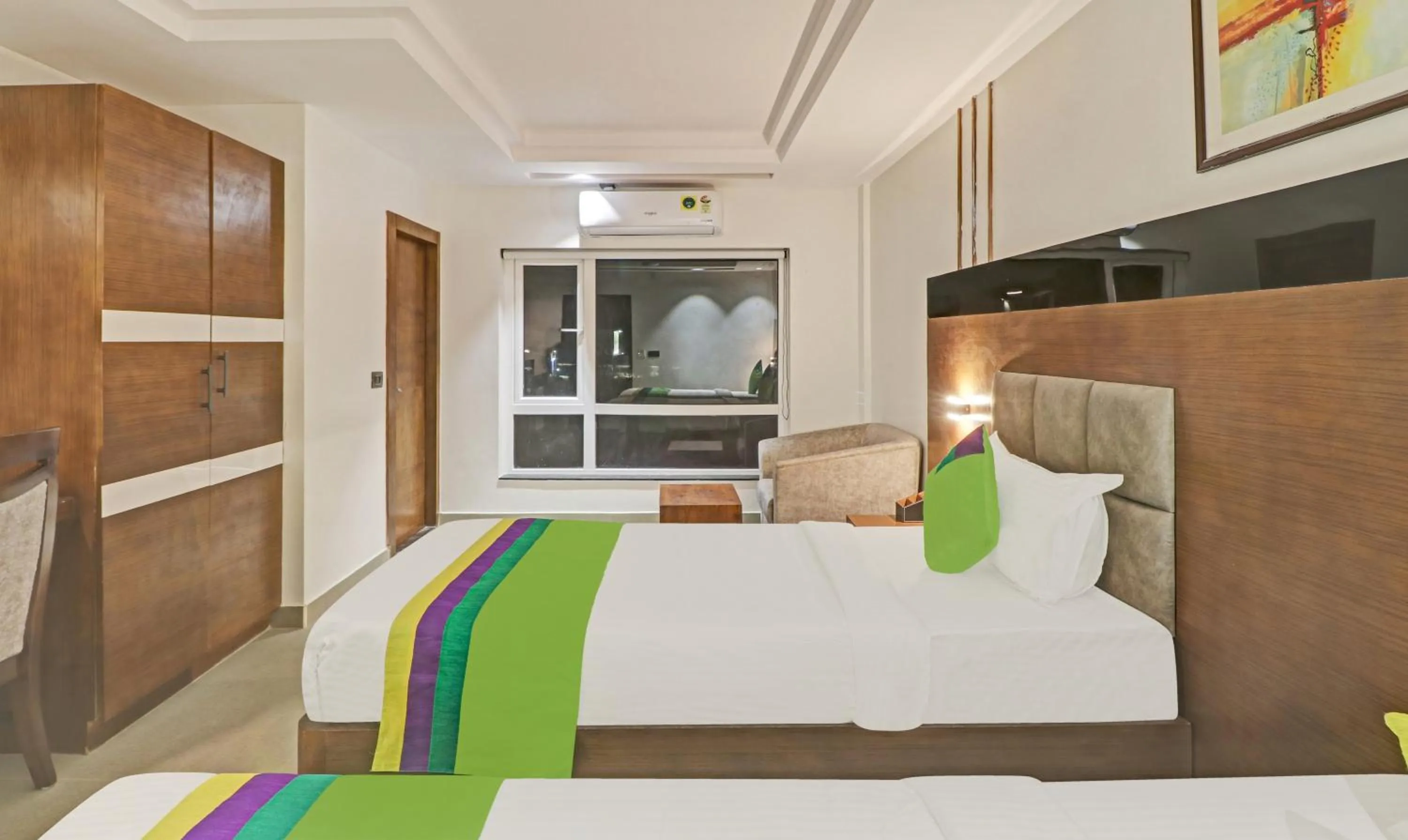 Photo of the whole room, Bed in Treebo Emora Grand