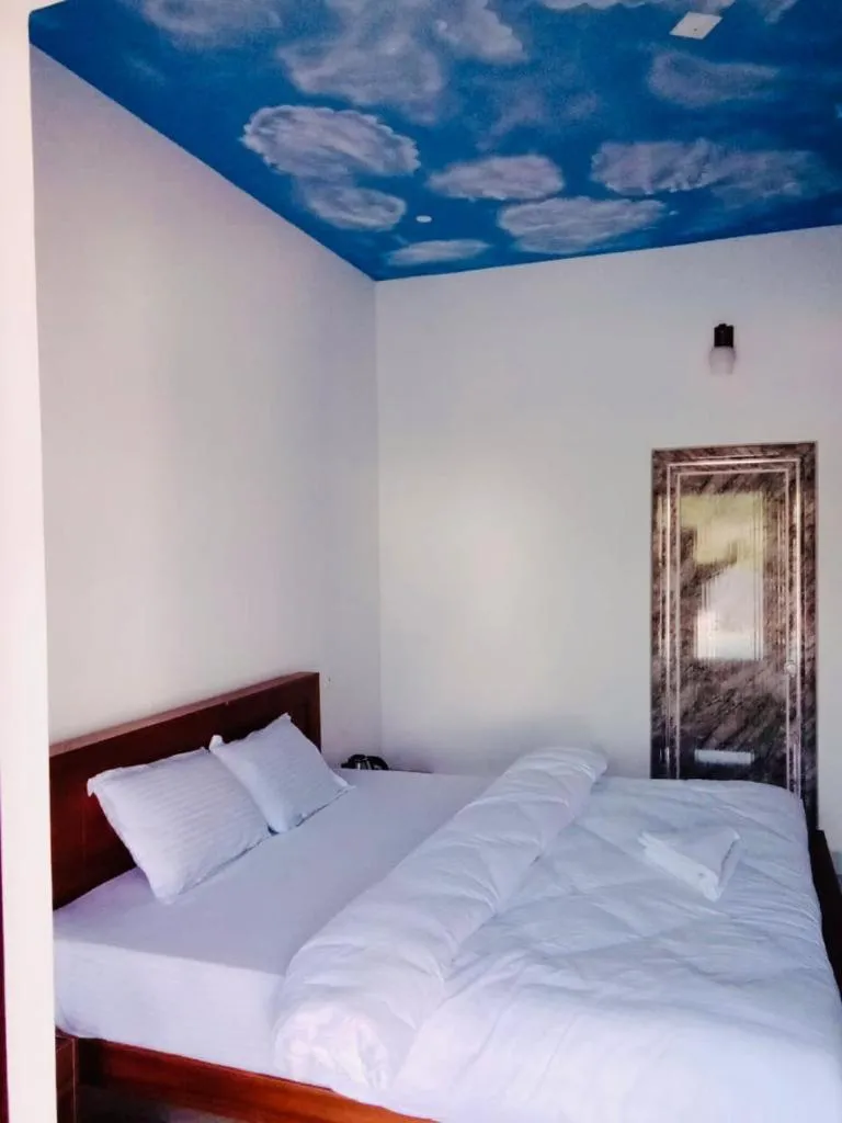 Bed in The Lavender Resort Waynad