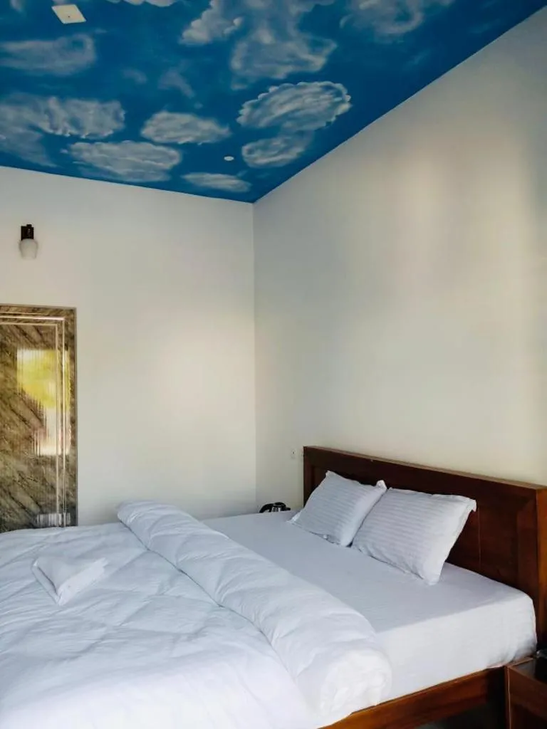 Bed in The Lavender Resort Waynad