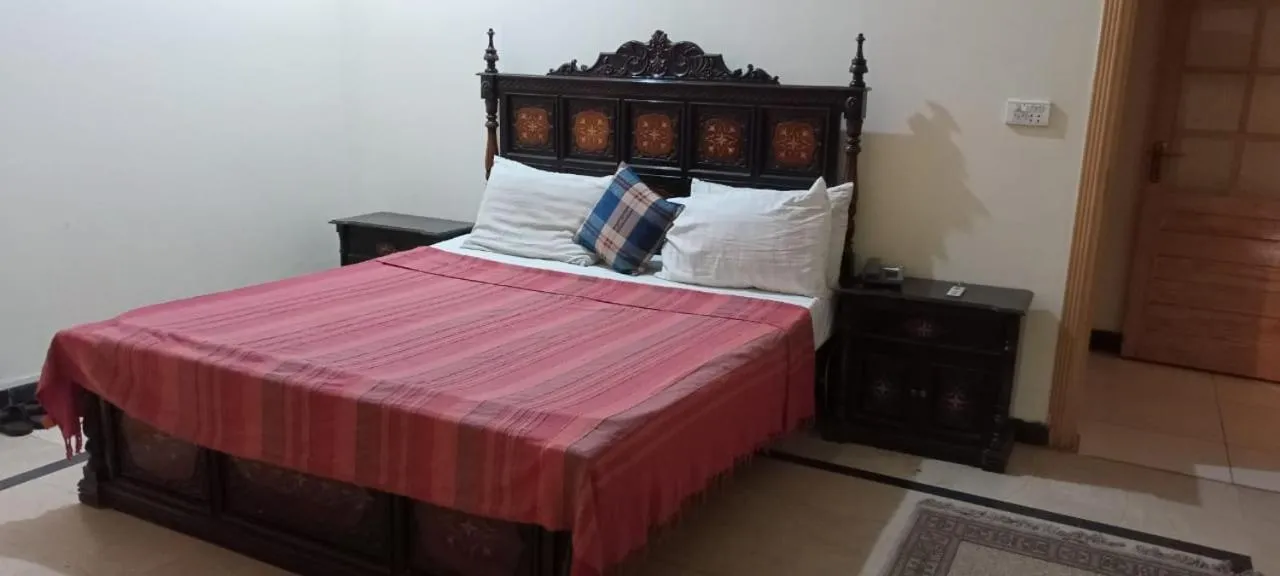 Photo of the whole room, Bed in Luxury Palace Peshawar