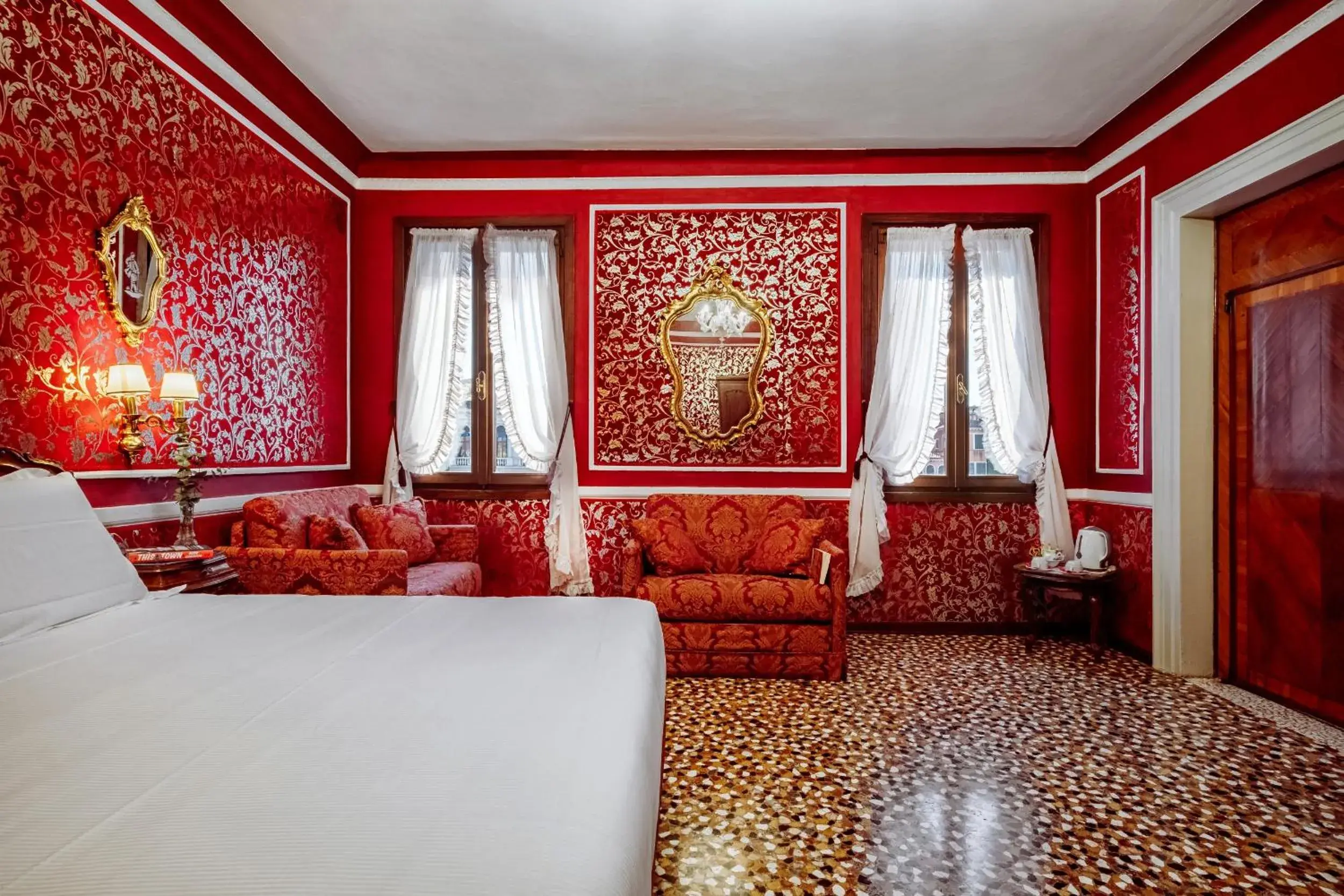 Decorative detail, Bed in Antica Locanda Sturion Residenza d'Epoca Decorative detail, Bed in Antica Locanda Sturion Residenza d'Epoca