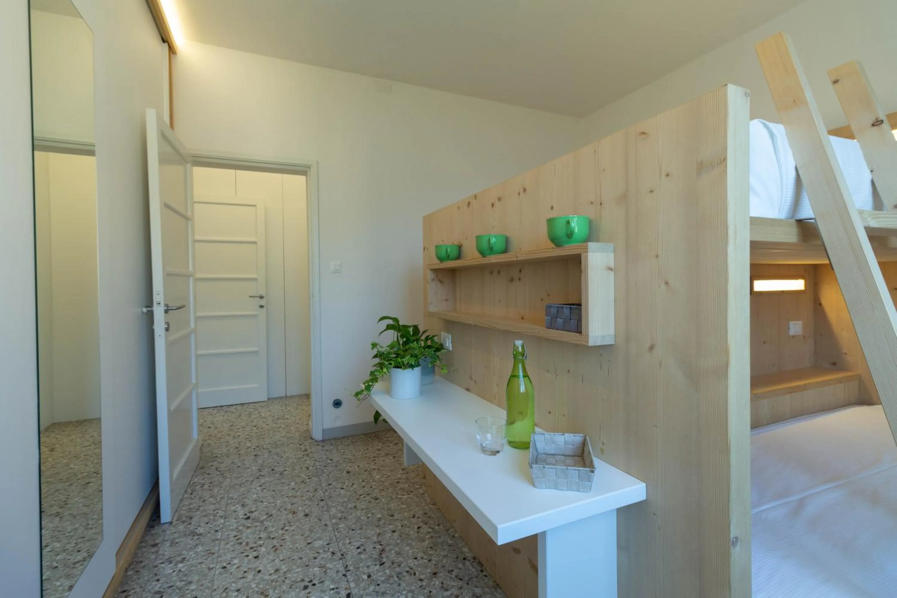Bed in Mamma Ciccia Holiday Home - Waterfront Apartment