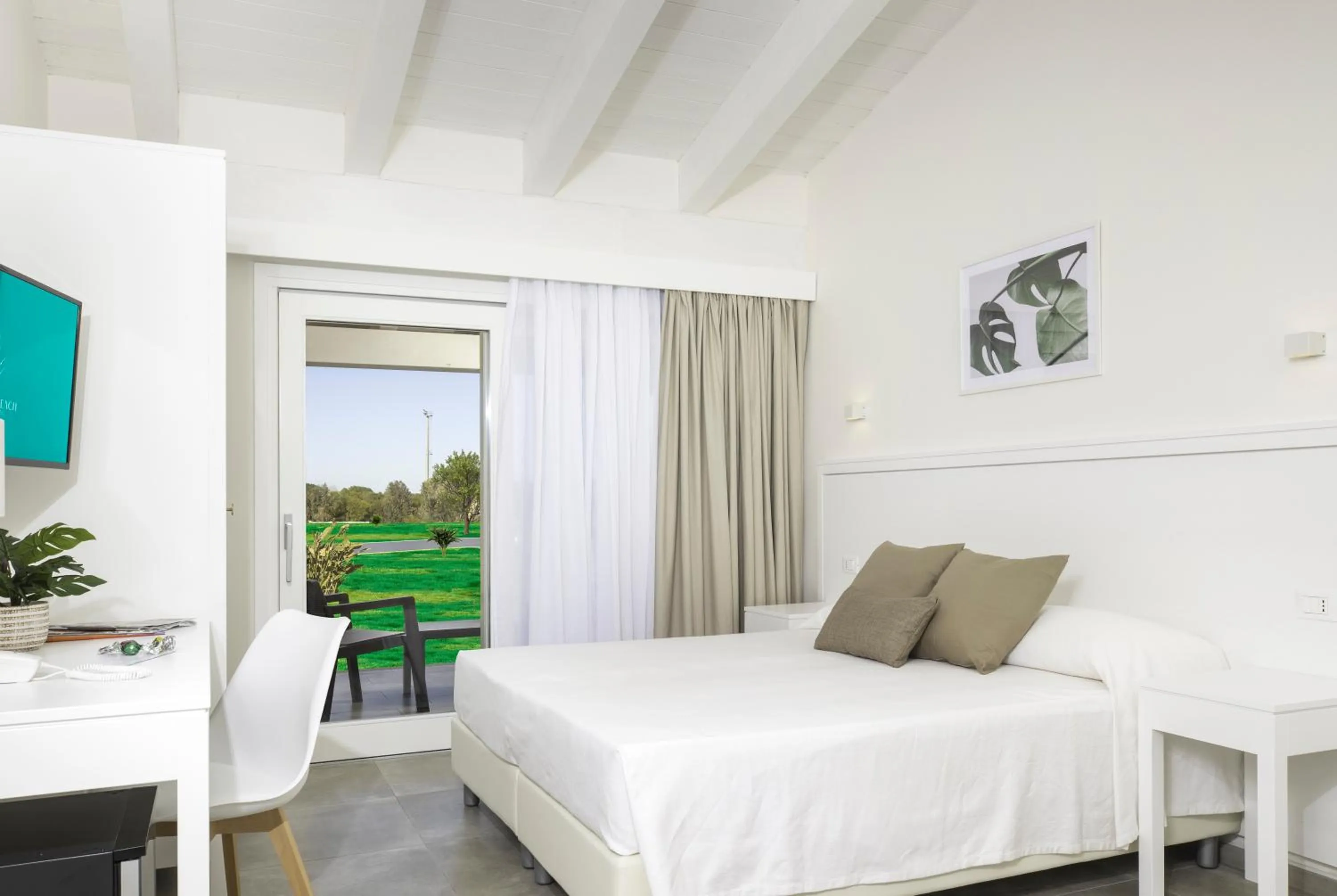 Bed in Hotel S'arena Beach