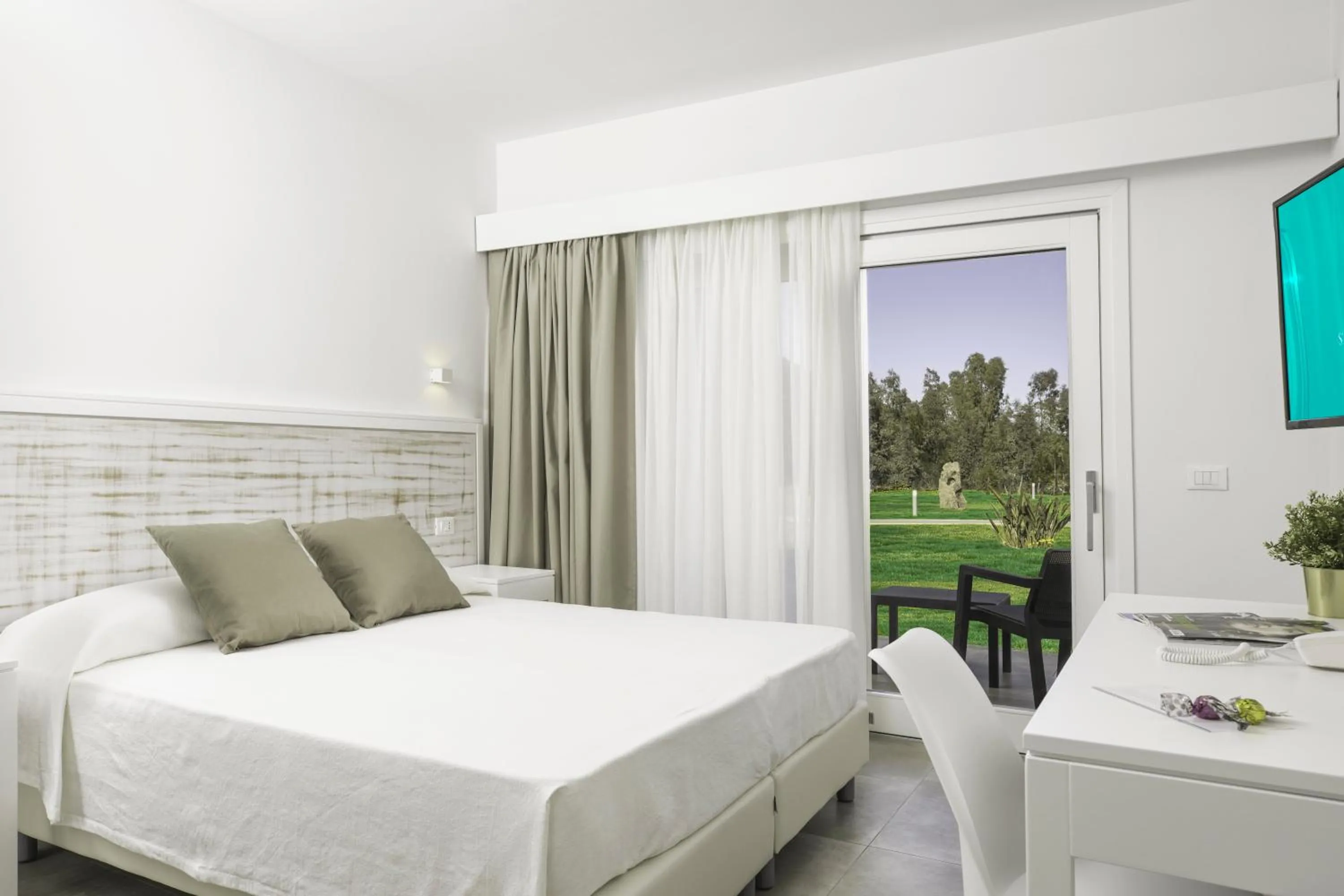 Bed in Hotel S'arena Beach