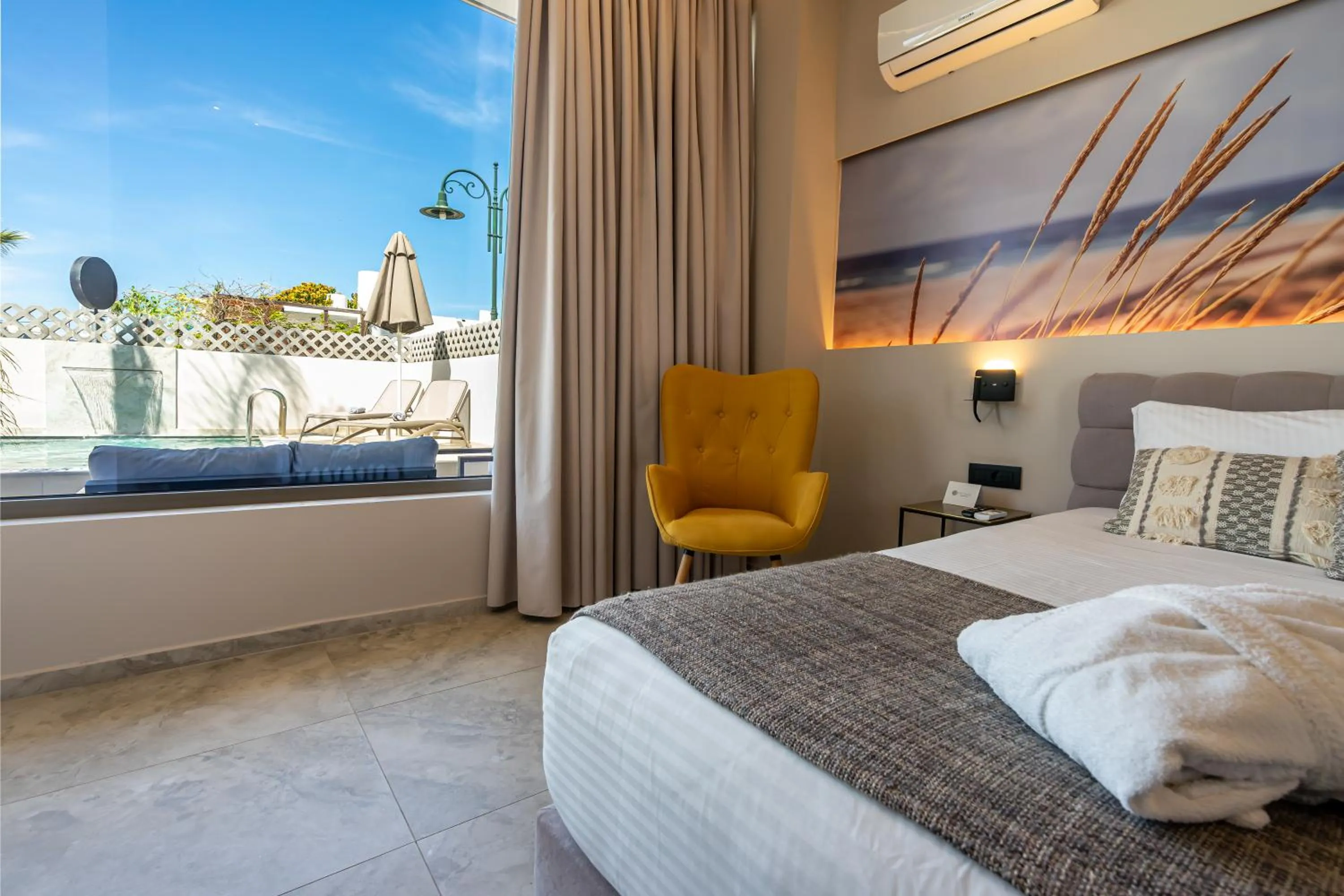 Bed in Pathos SeaSide Suites