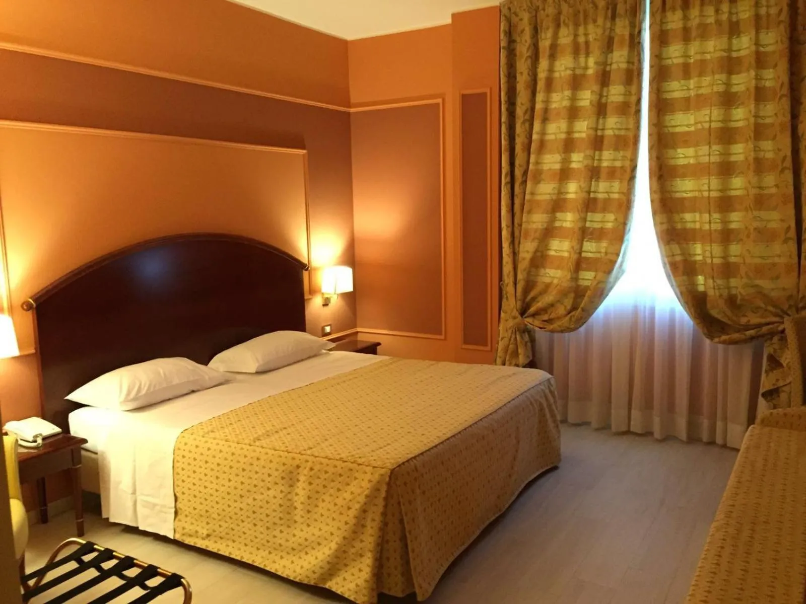 Bed in Savoia Hotel Regency