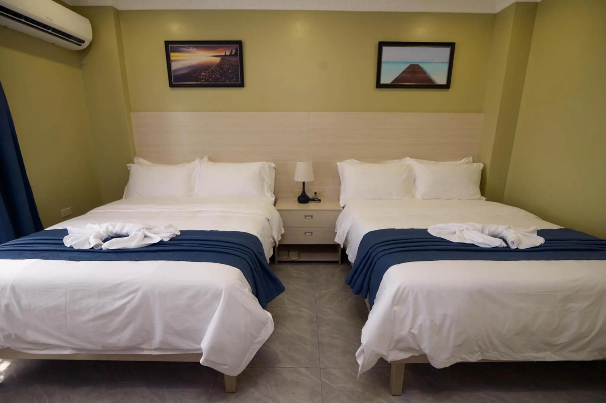 Photo of the whole room, Bed in The Caye Hotel Caye Caulker
