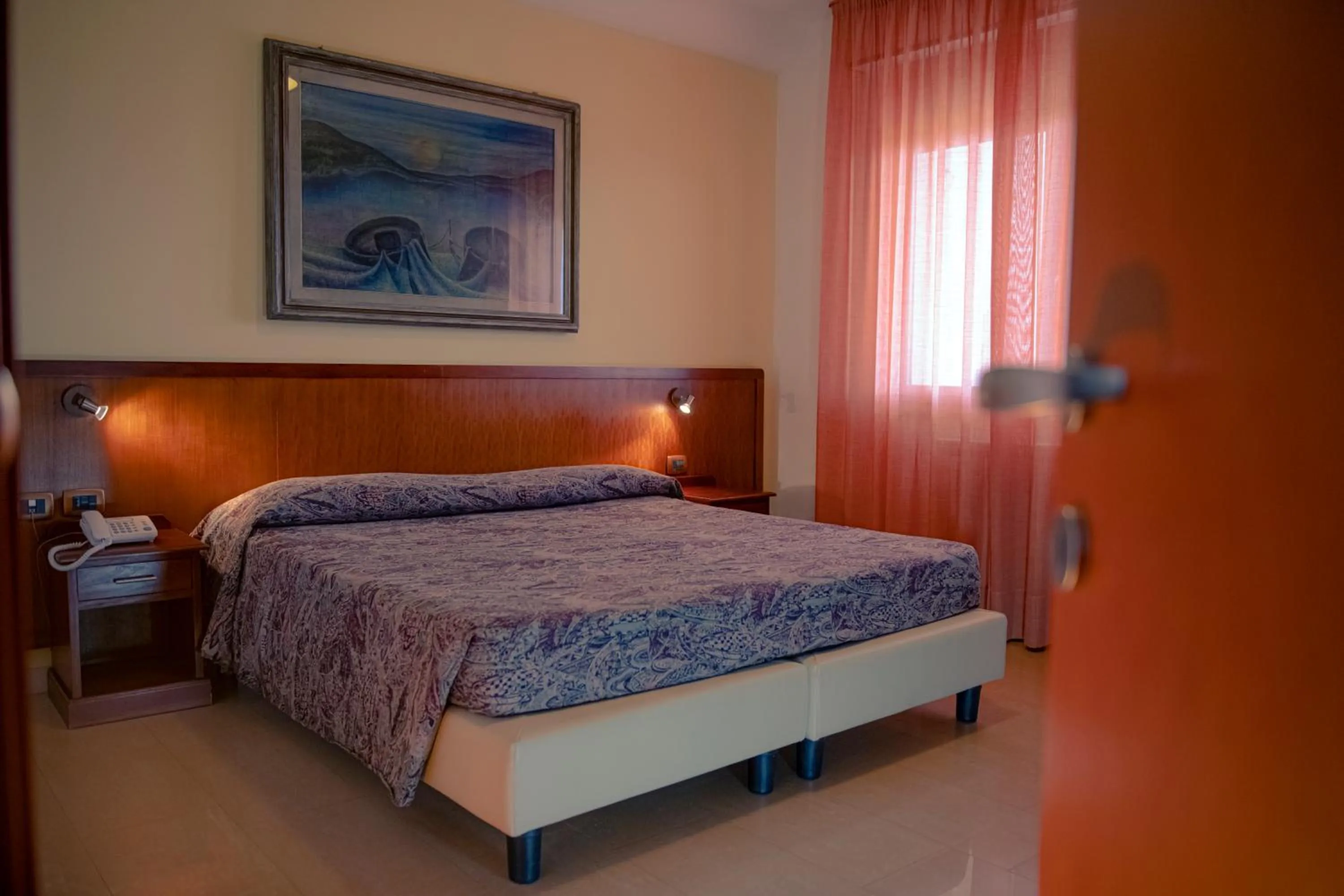 Bed in Hotel Califfo