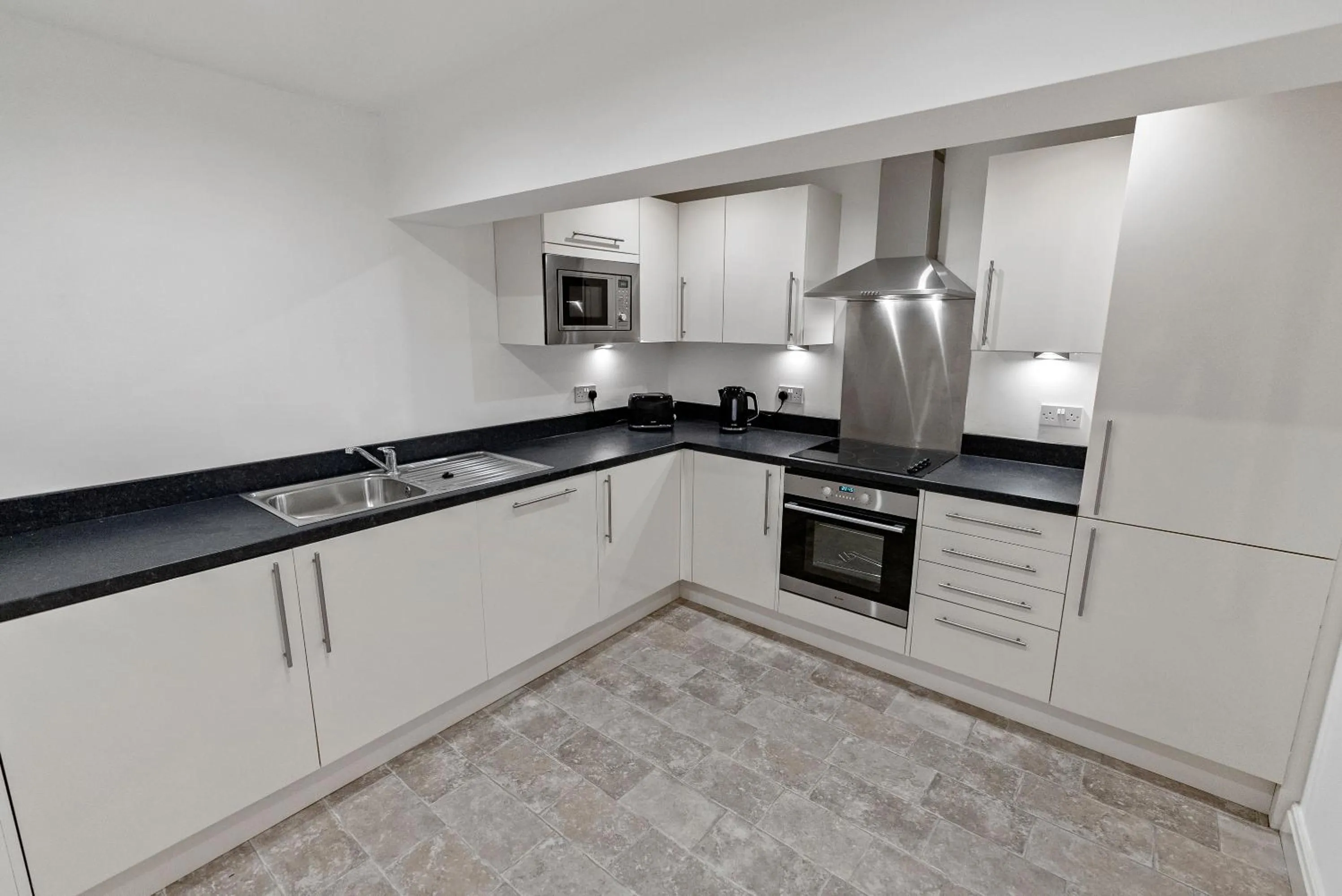 Kitchen or kitchenette in Mode Apartments Winter Gardens Blackpool