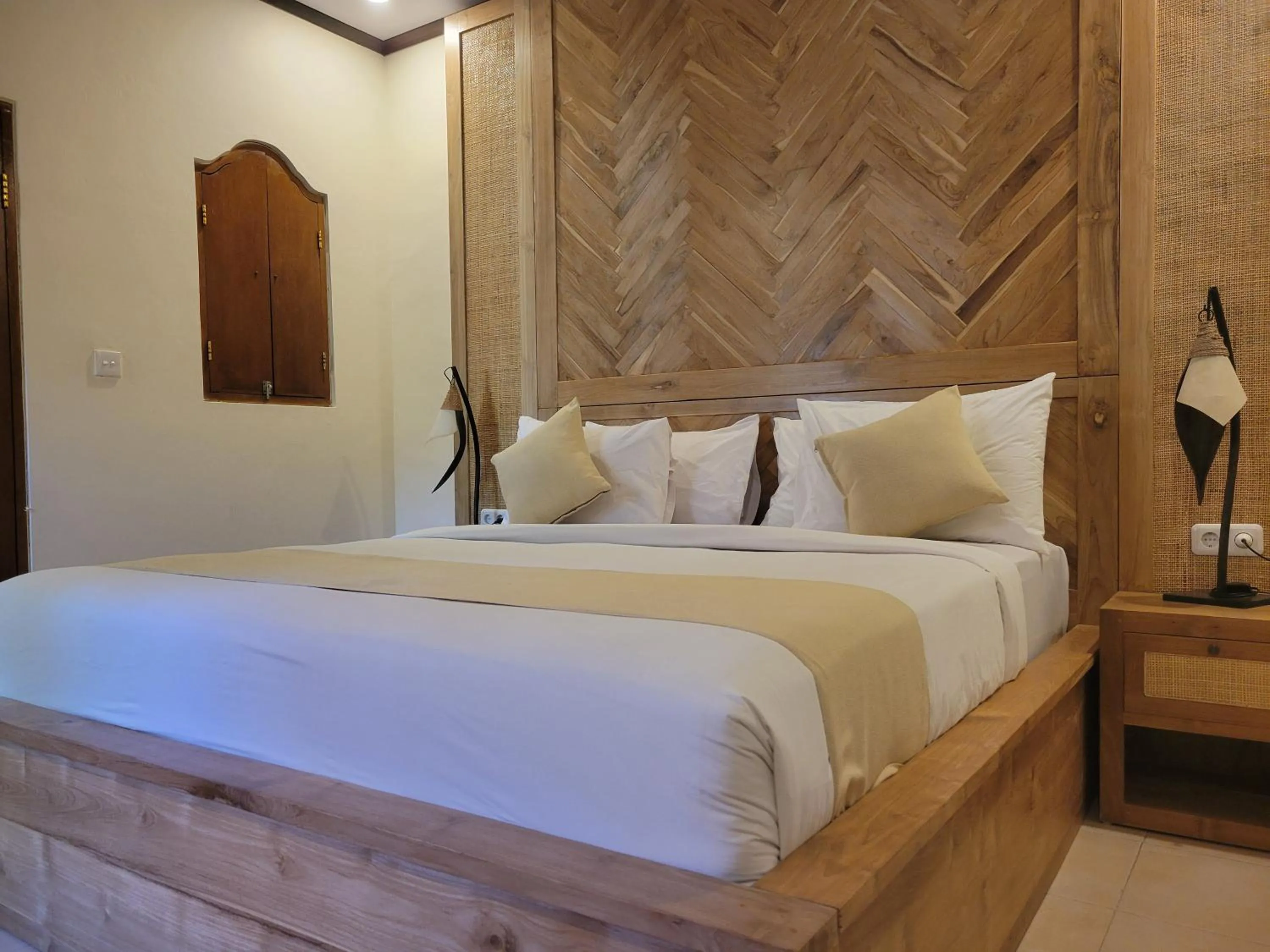 Bed in Kusnadi Hotel