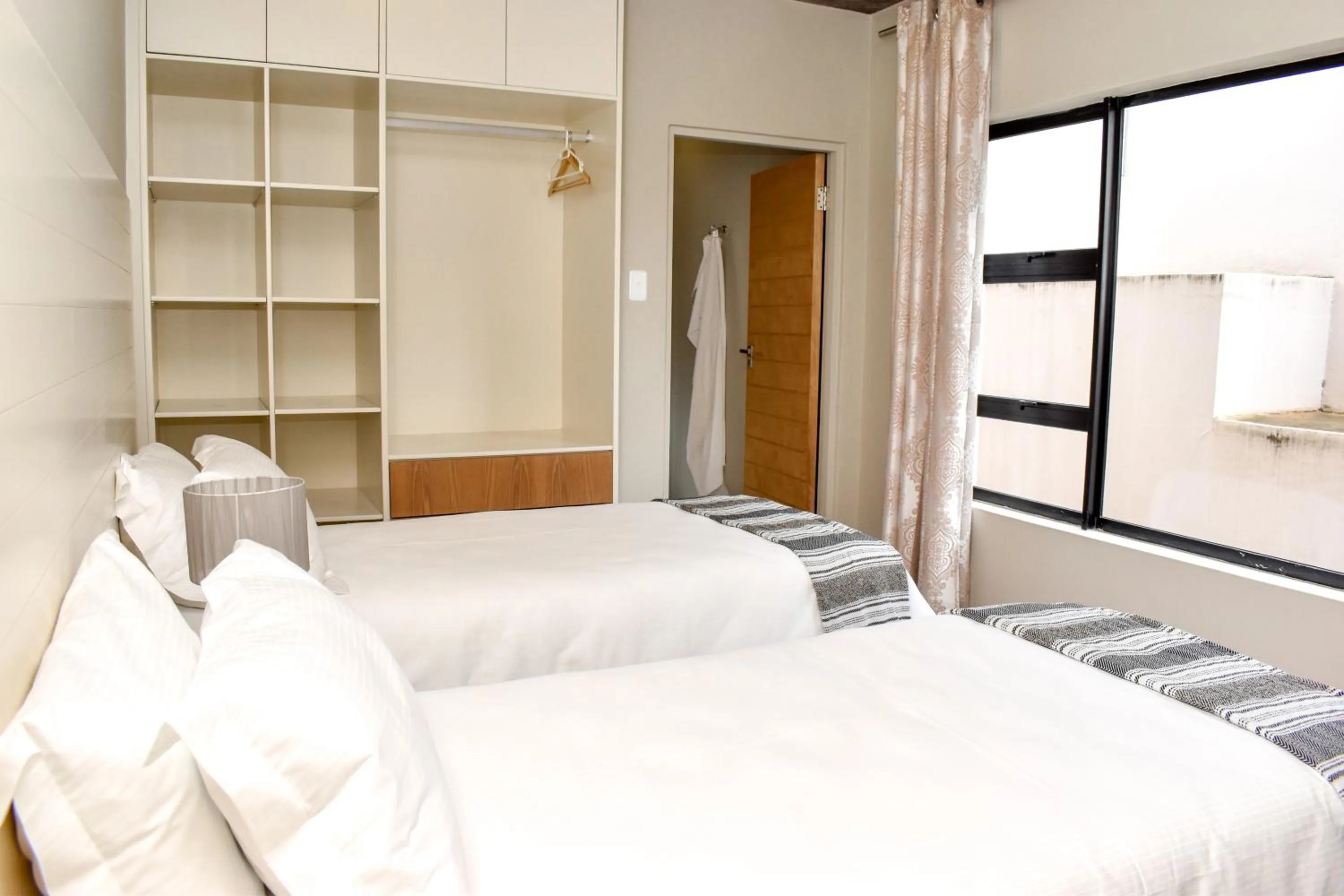 Bed in Amabwe Guesthouse