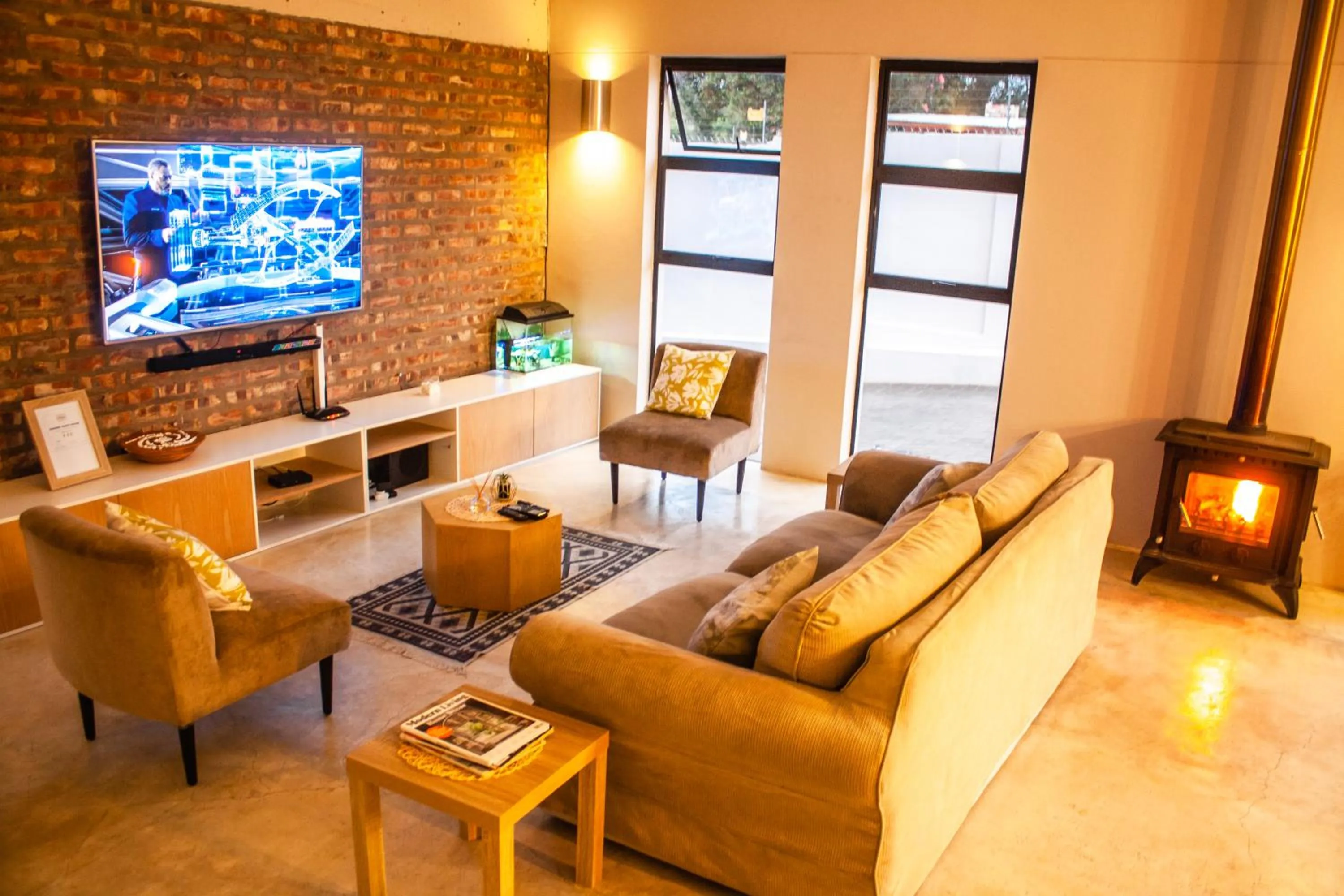 Communal lounge/ TV room in Amabwe Guesthouse