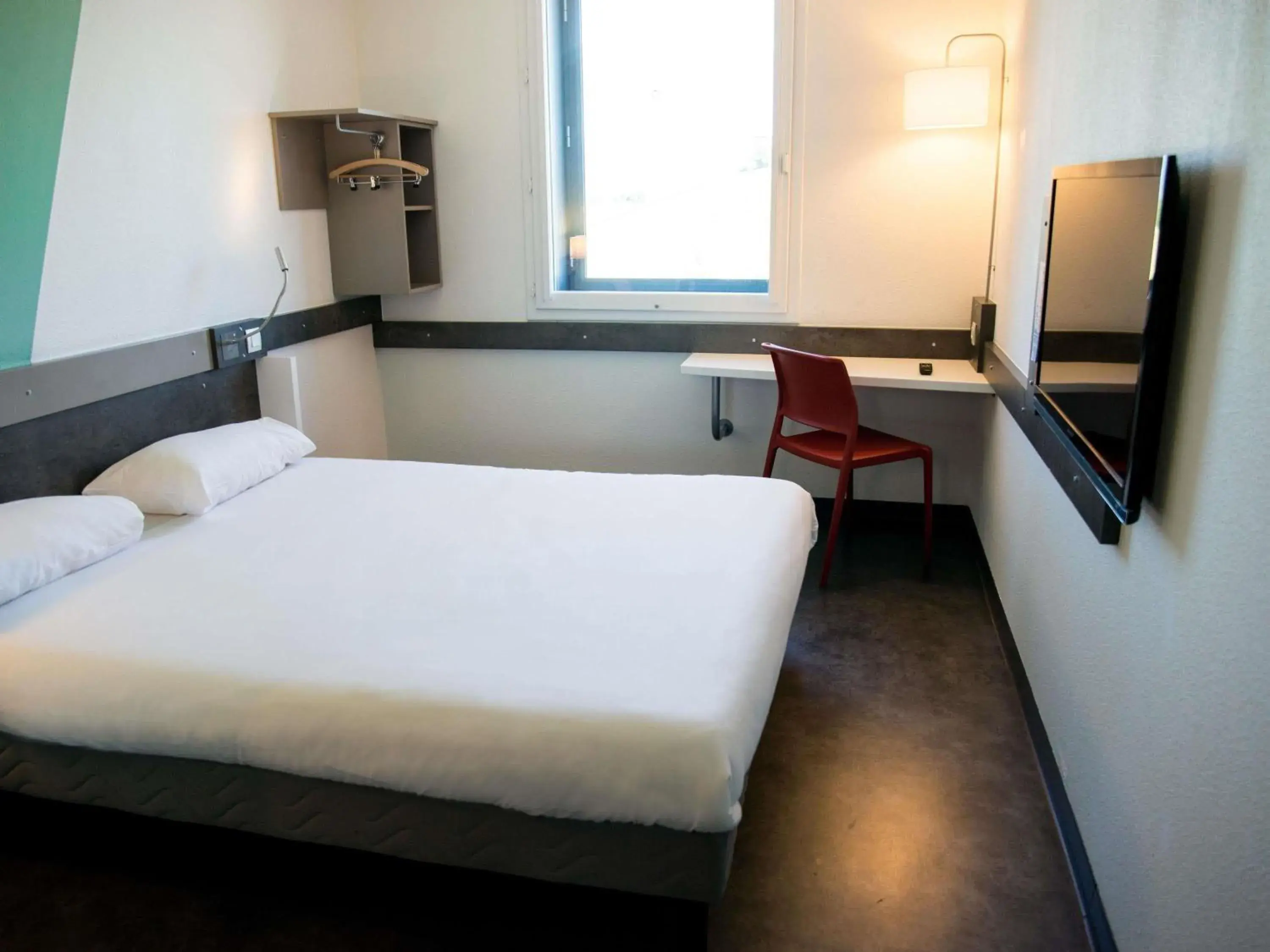 Property building, Bed in Ibis Budget Archamps Porte de Genève Property building, Bed in Ibis Budget Archamps Porte de Genève