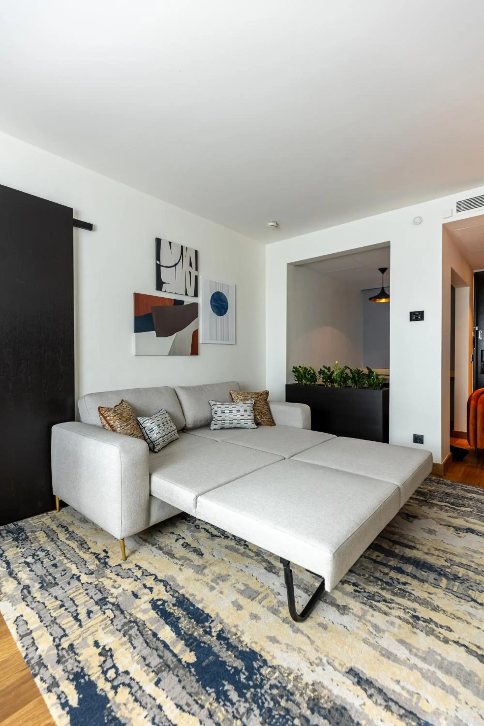 Living room, Bed in Crowne Plaza Belgrade by IHG Living room, Bed in Crowne Plaza Belgrade by IHG