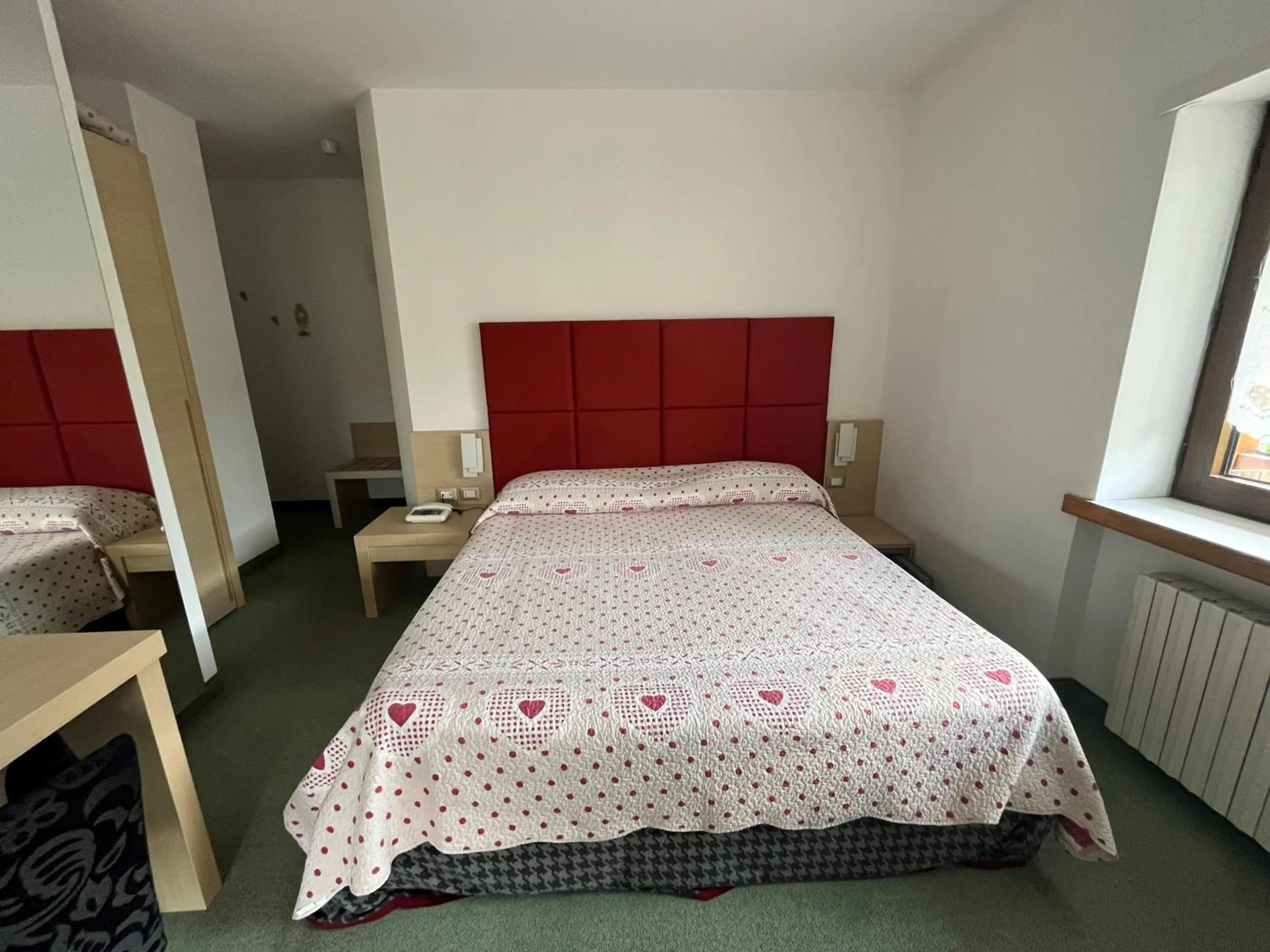 Bed in Monaco Sport Hotel