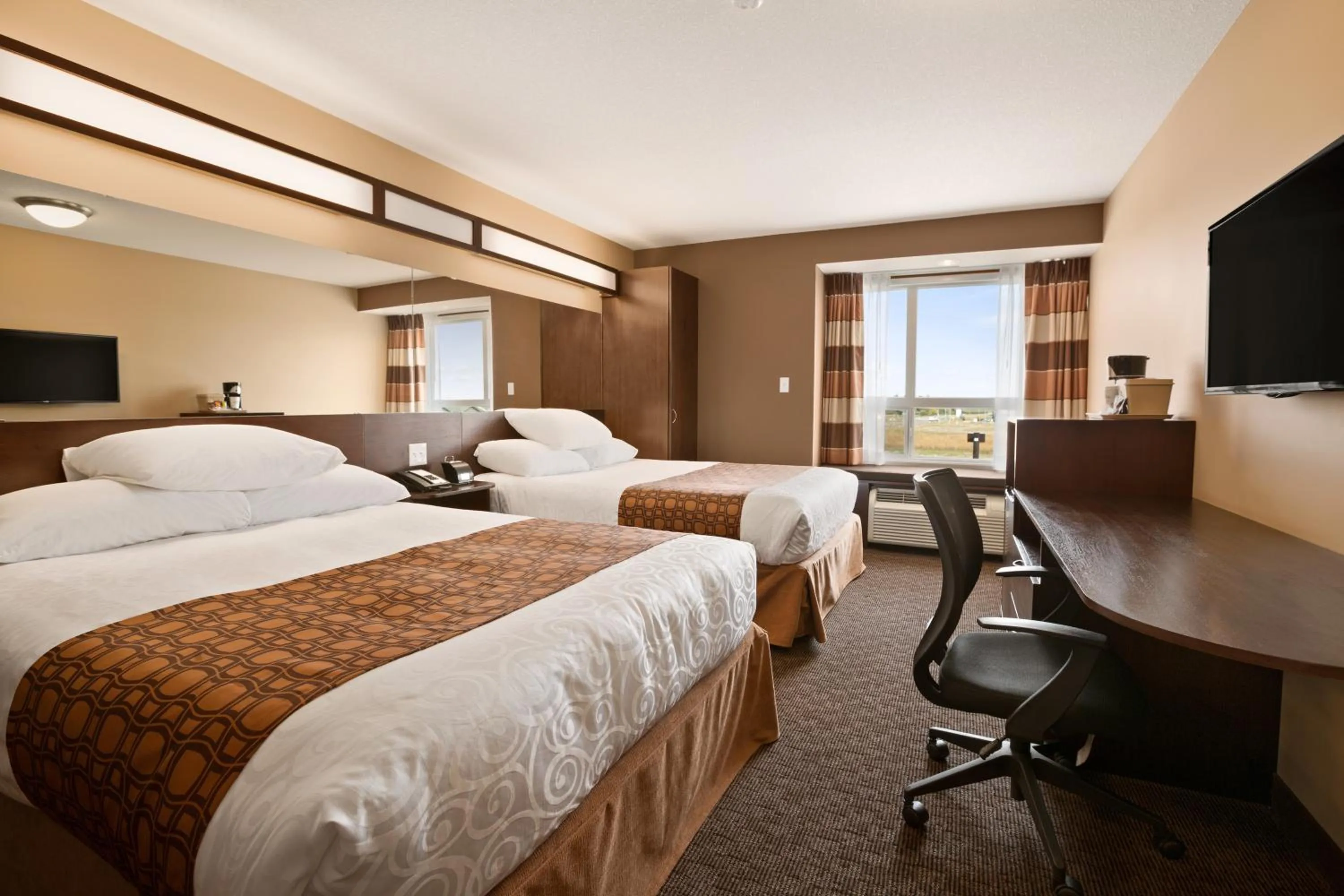 Photo of the whole room, Bed in Microtel Inn & Suites by Wyndham Blackfalds