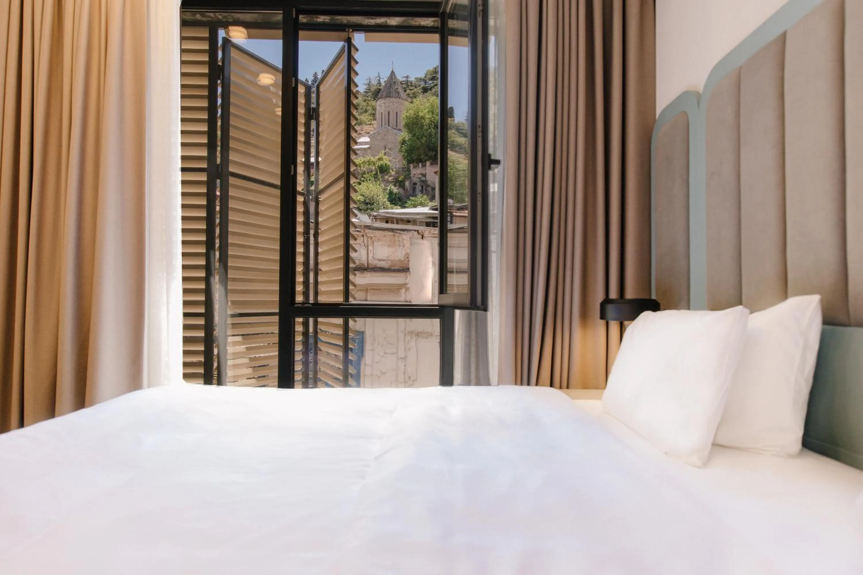 Bed in STROFI Boutique Hotel
