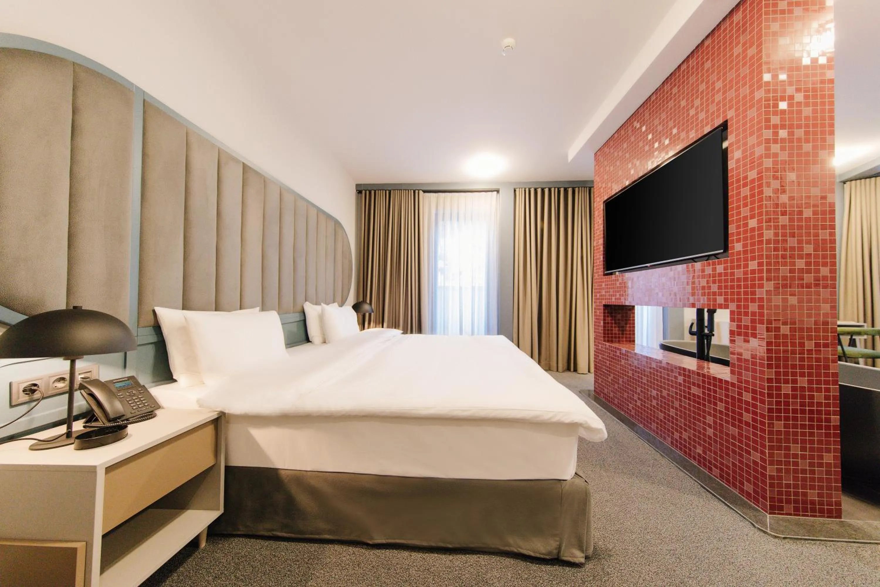 Bed in STROFI Boutique Hotel