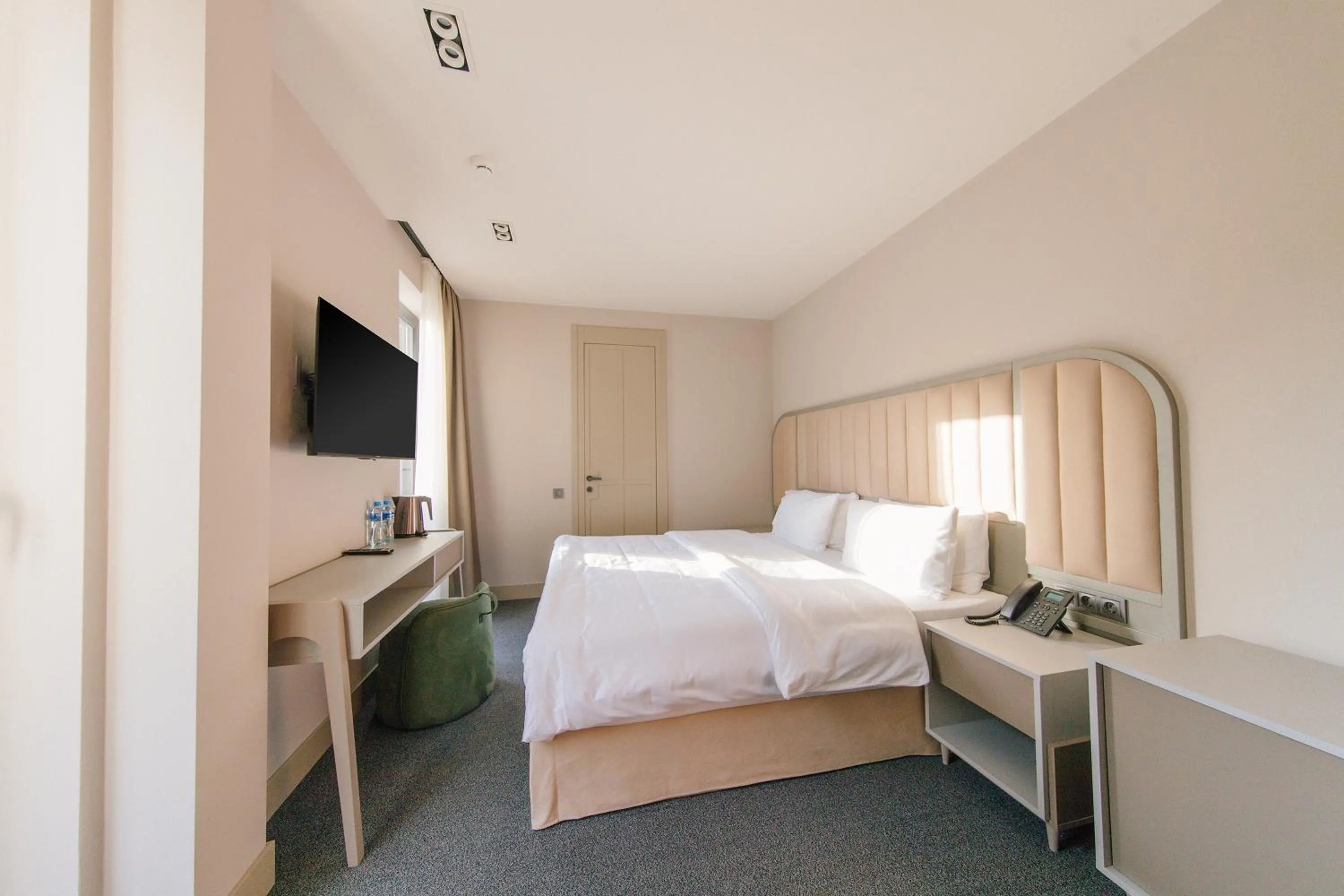 Bed in STROFI Boutique Hotel