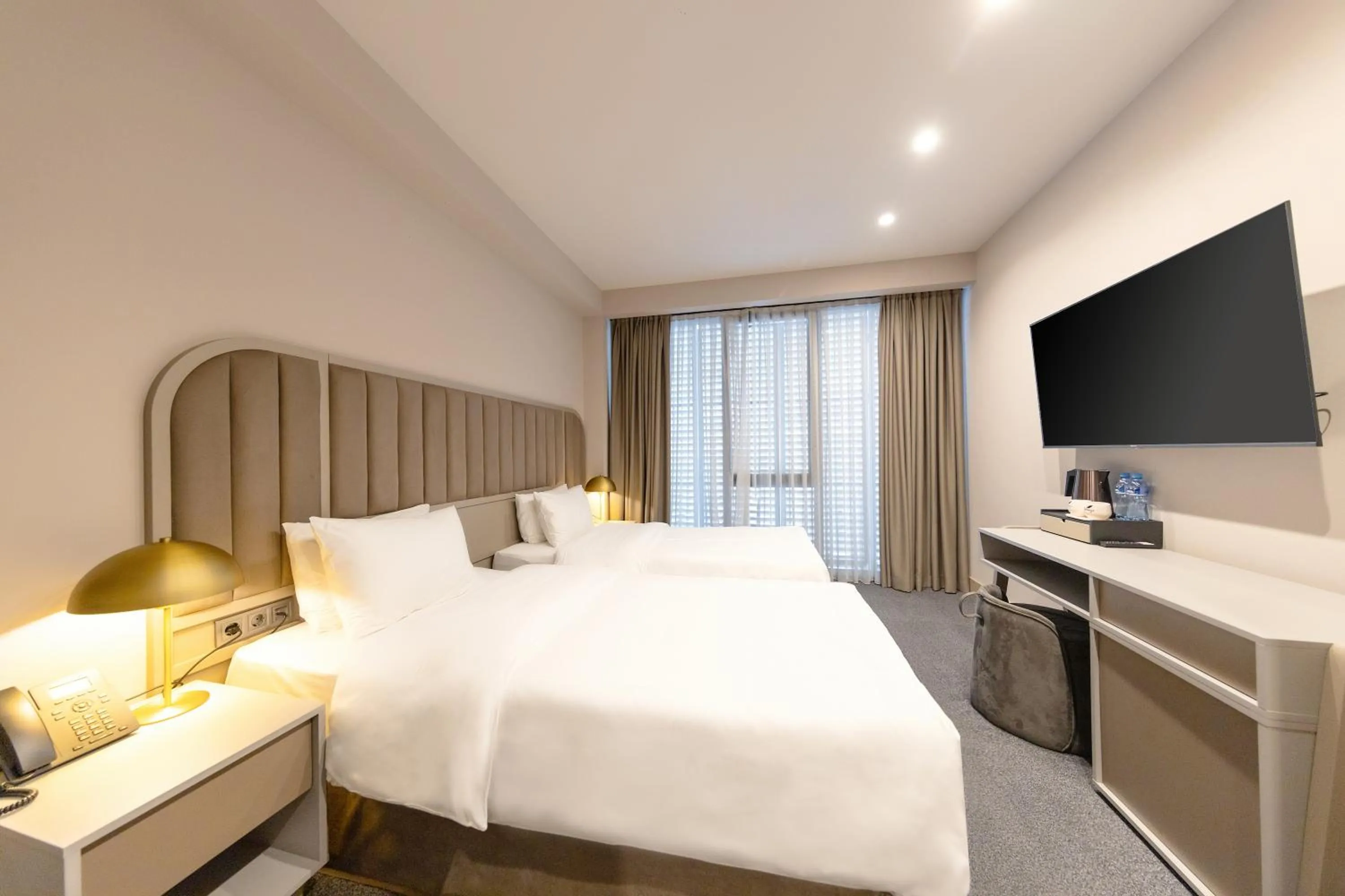 Bed in STROFI Boutique Hotel