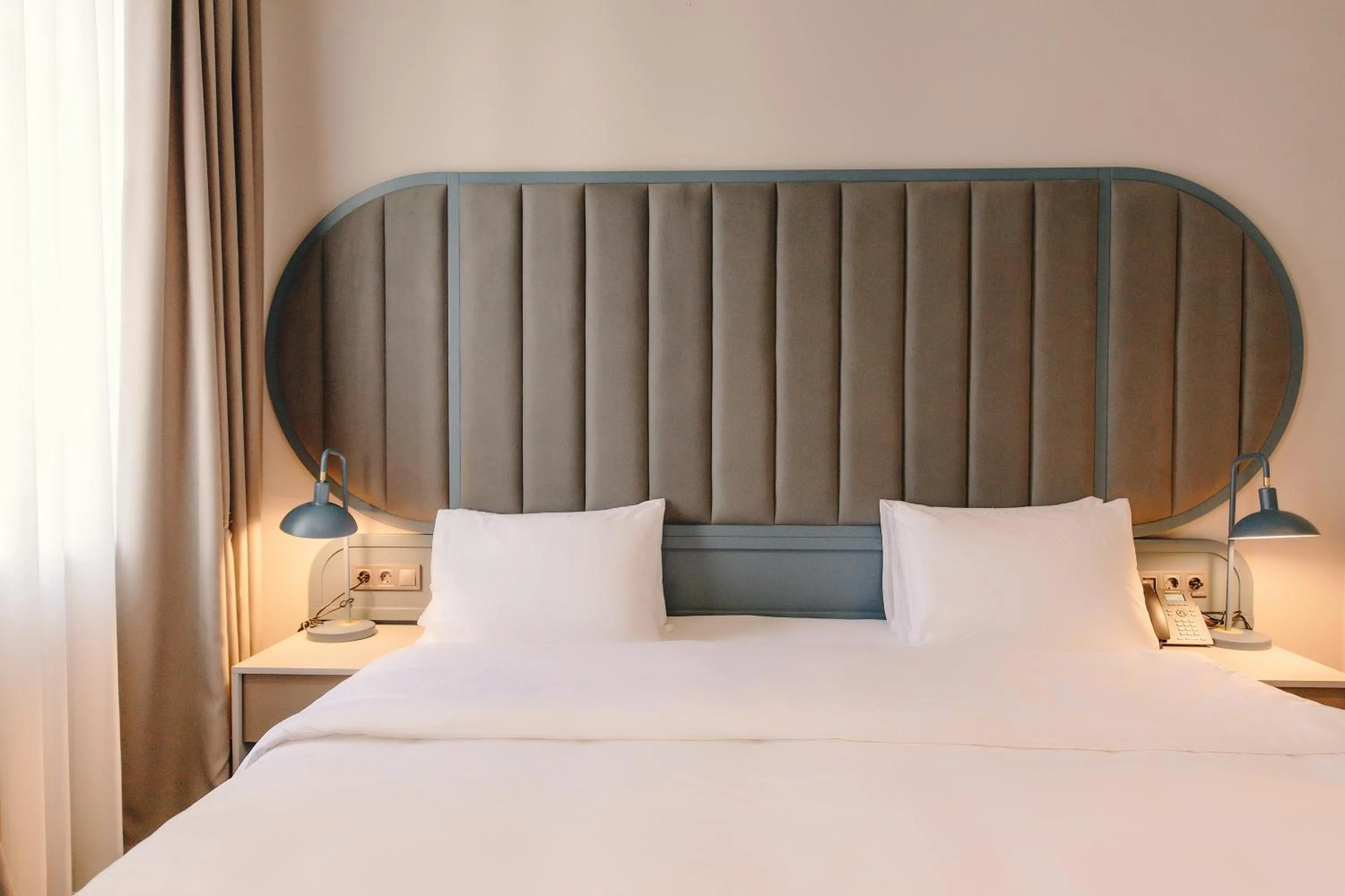 Bed in STROFI Boutique Hotel