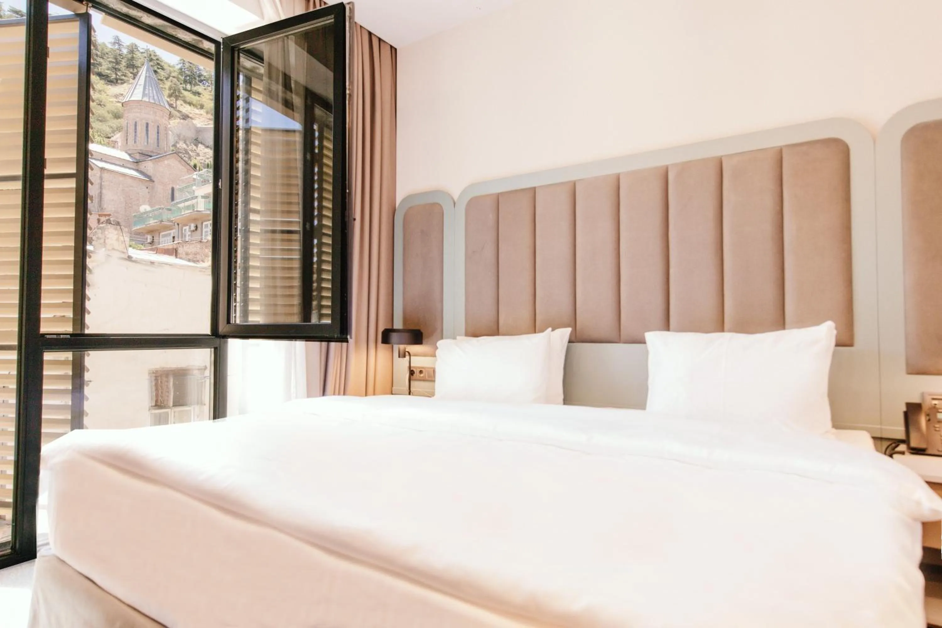 Bed in STROFI Boutique Hotel