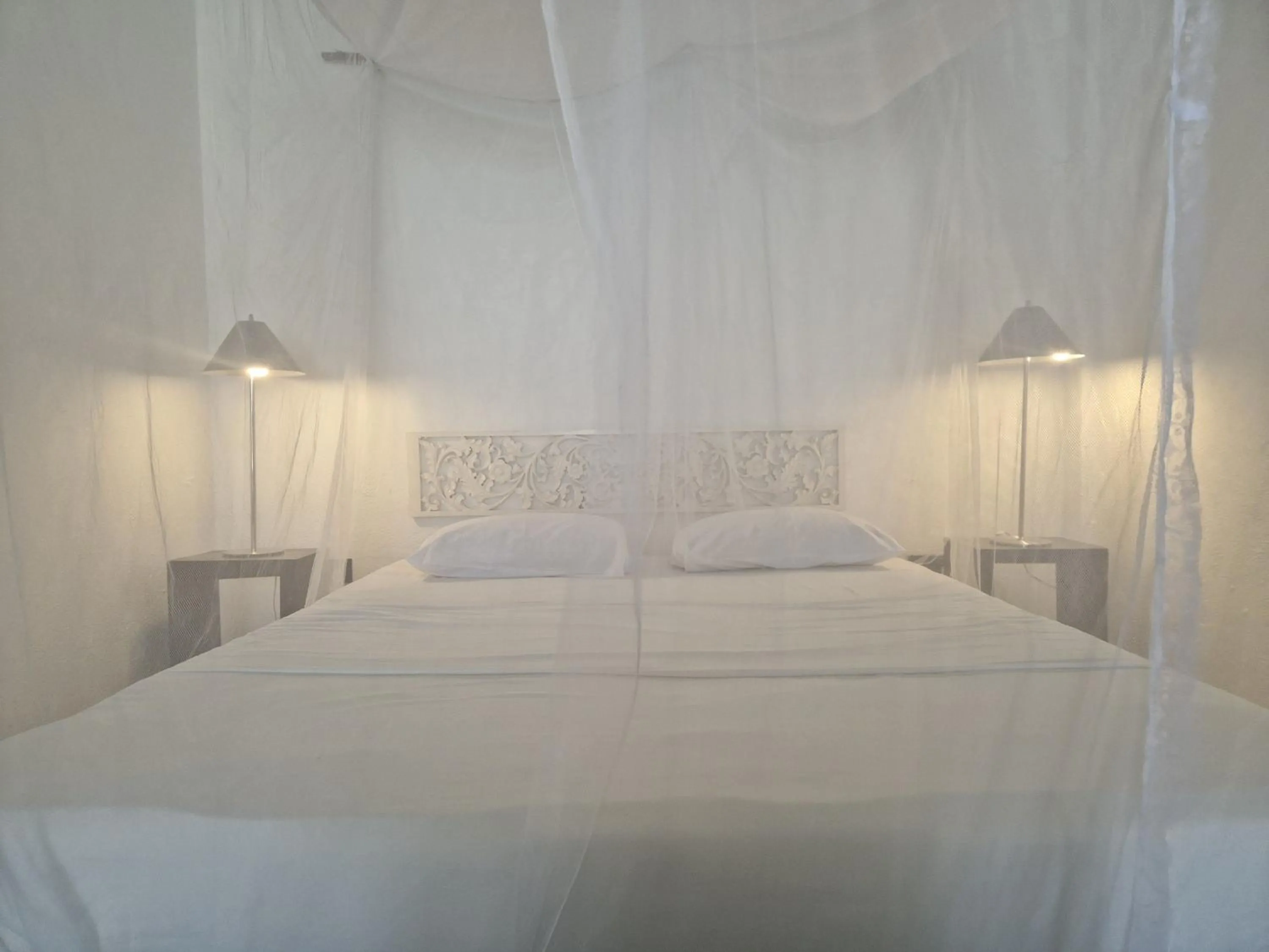 Bed in CocoVilla Boutique Resort