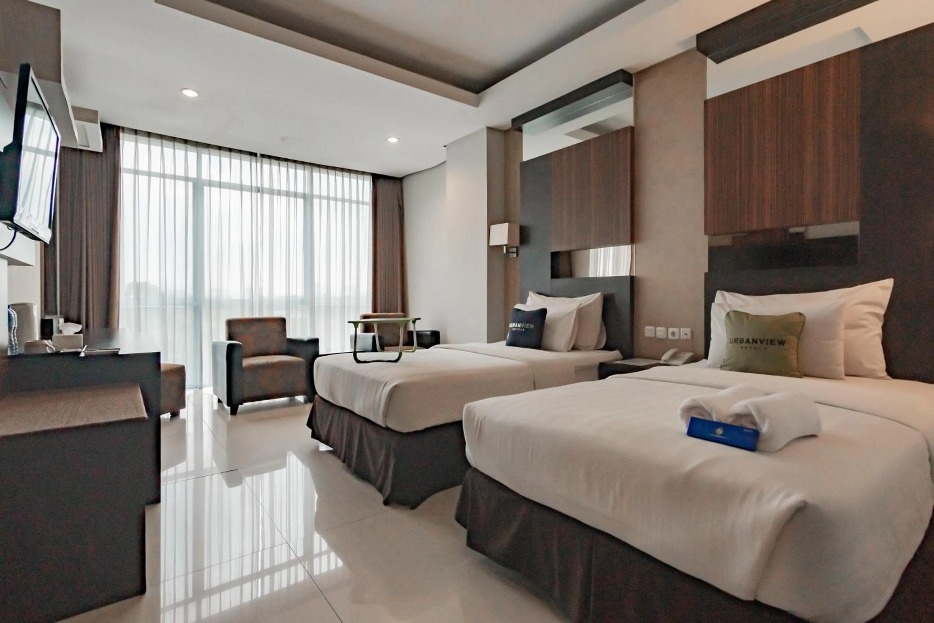 Bedroom, Bed in Urbanview Hotel Newton Riau Bandung by RedDoorz