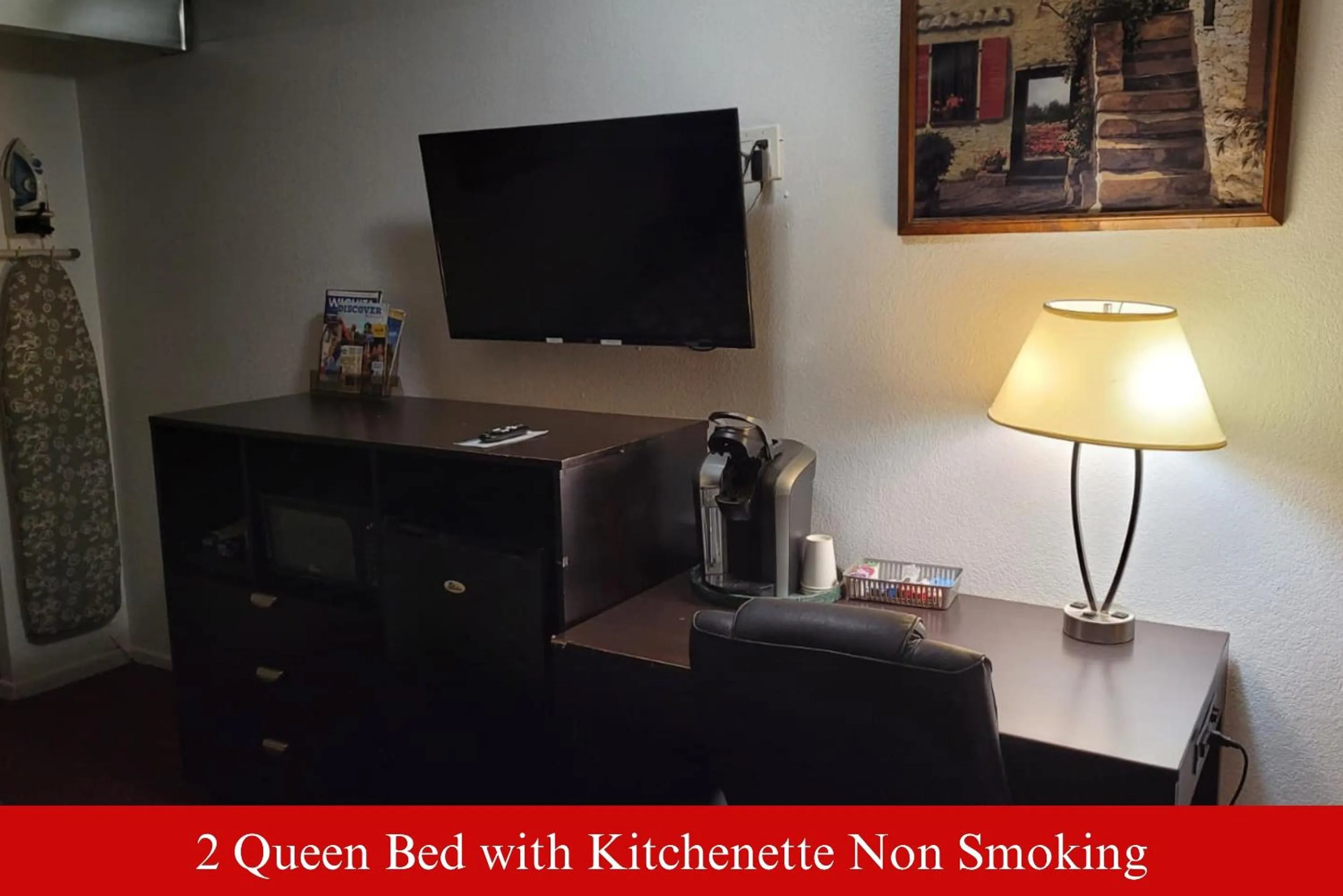 TV and multimedia in Coratel Inn & Suites by Jasper Hutchinson