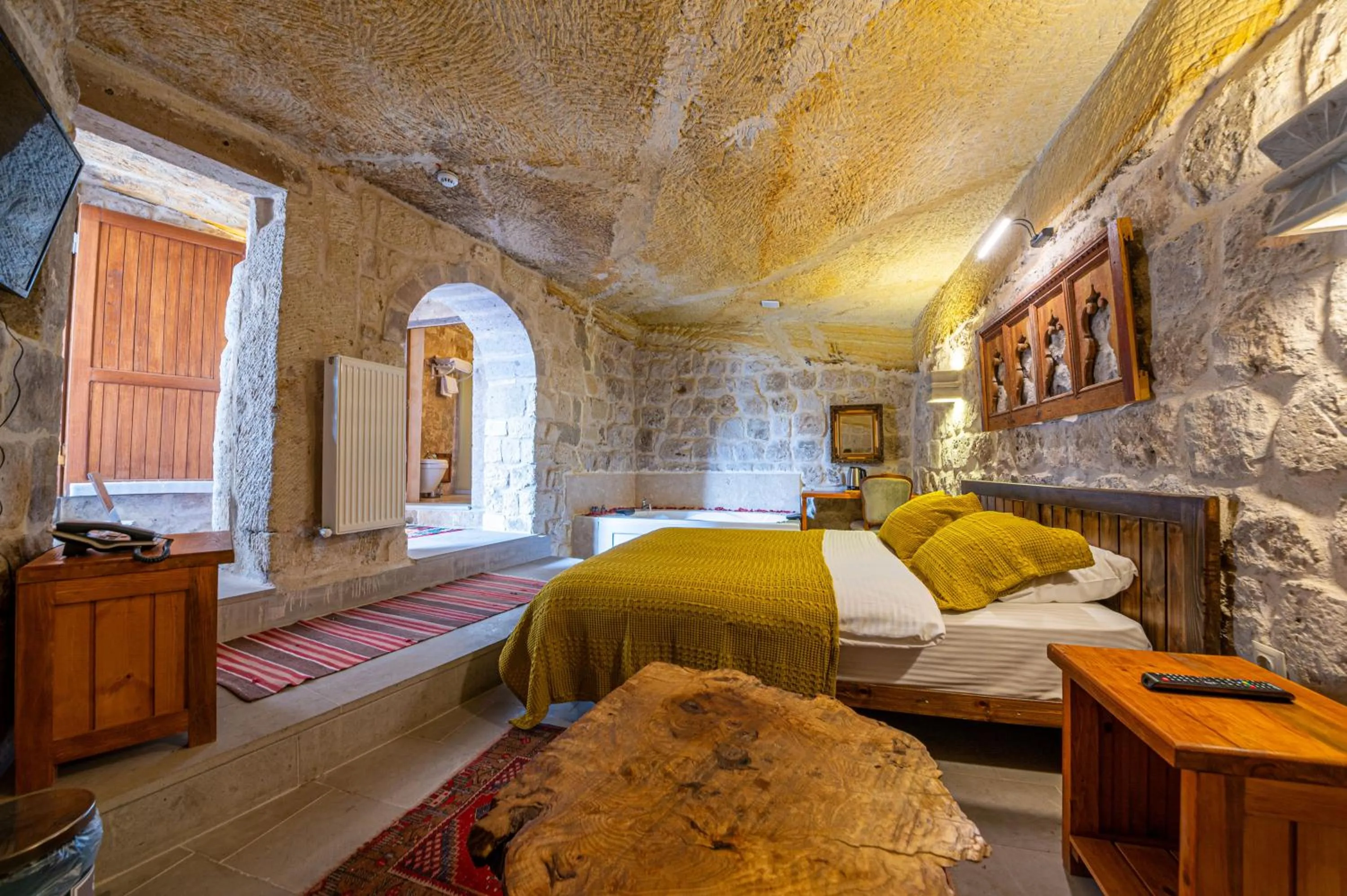 Bed in Kapalos Cave Hotel
