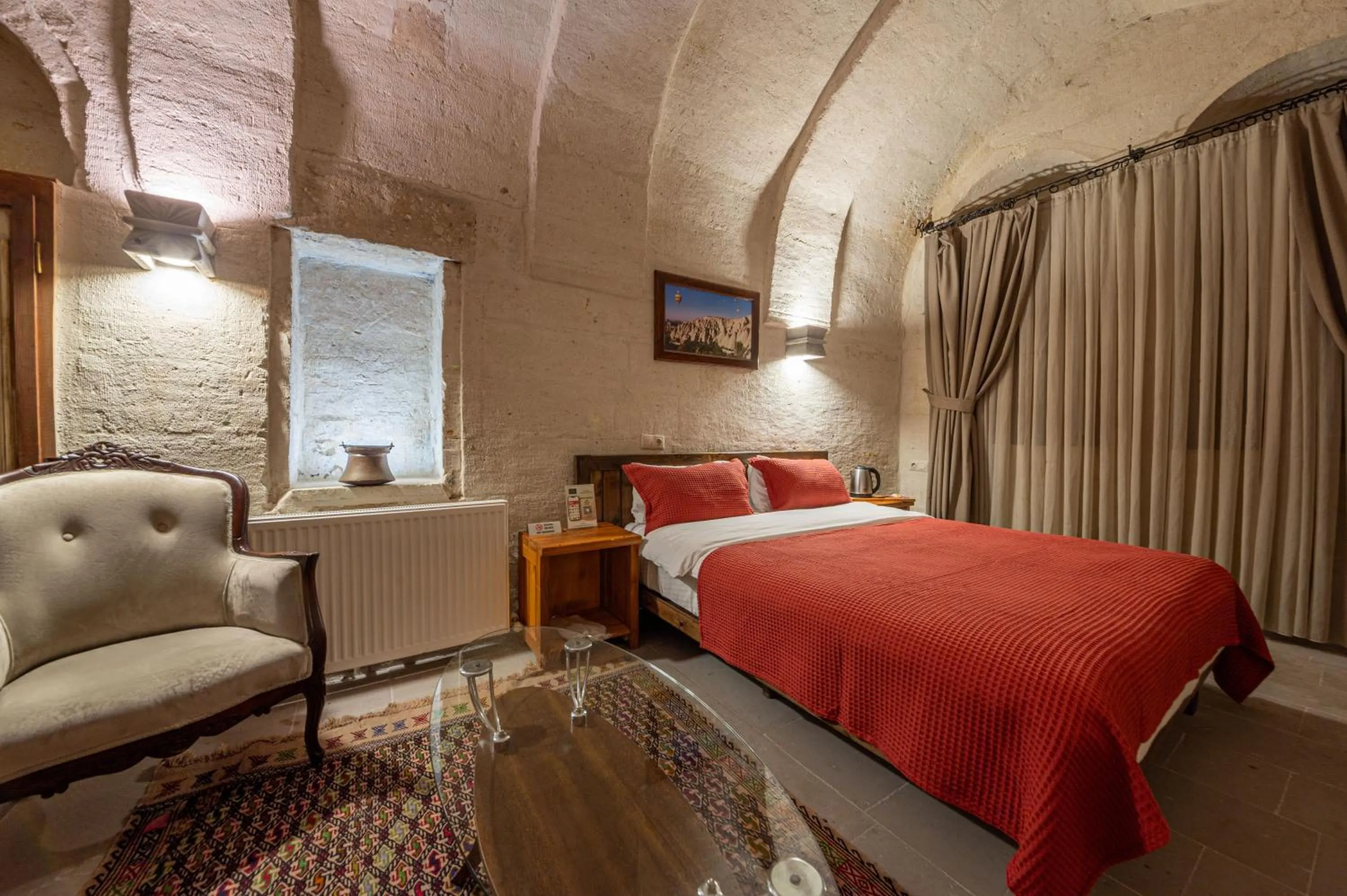 Bed in Kapalos Cave Hotel